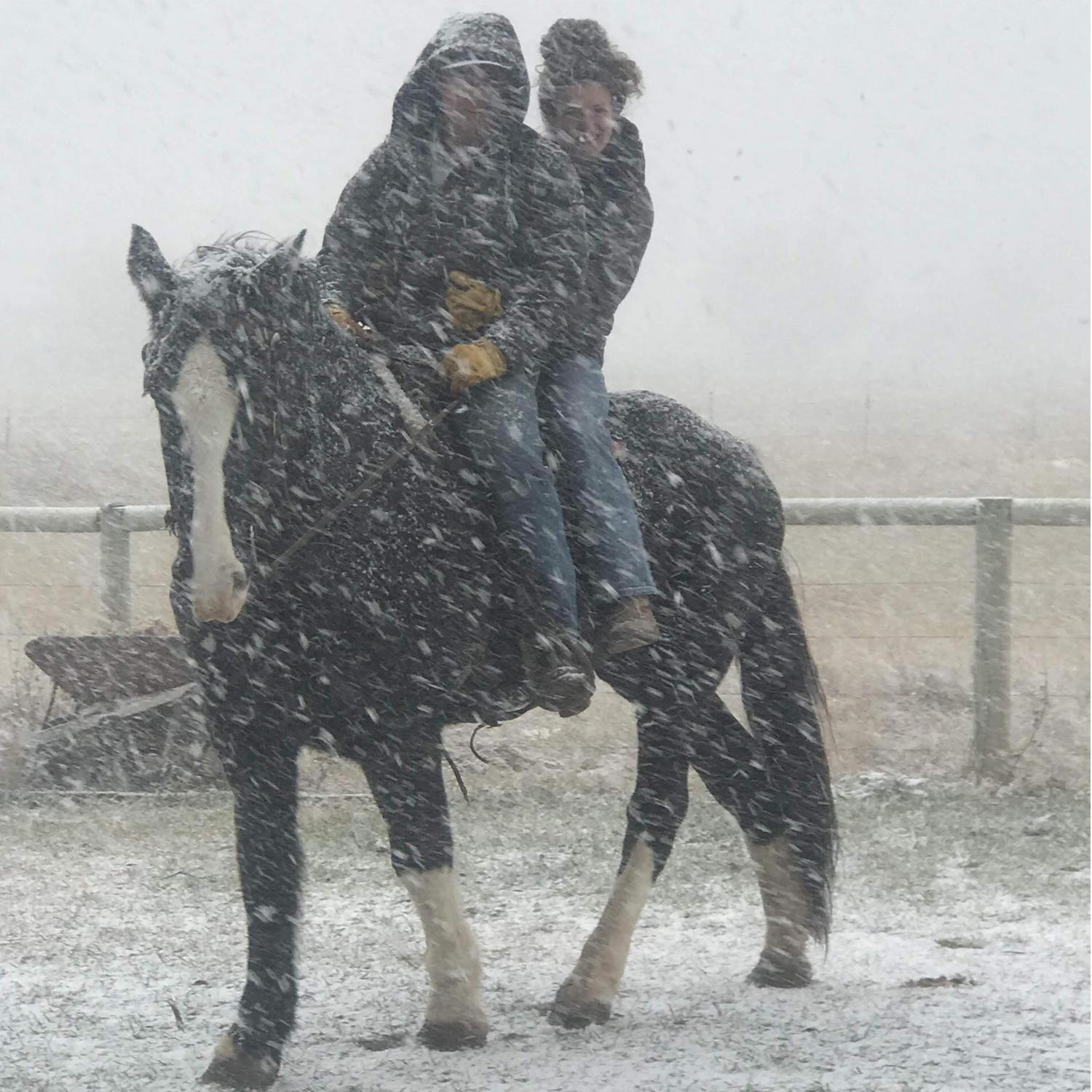 Nothing will stop these two from riding, not even a snowstorm!
