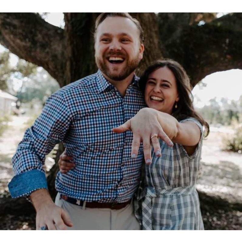 Sarah showing off that engagement bling. What a joyful day!