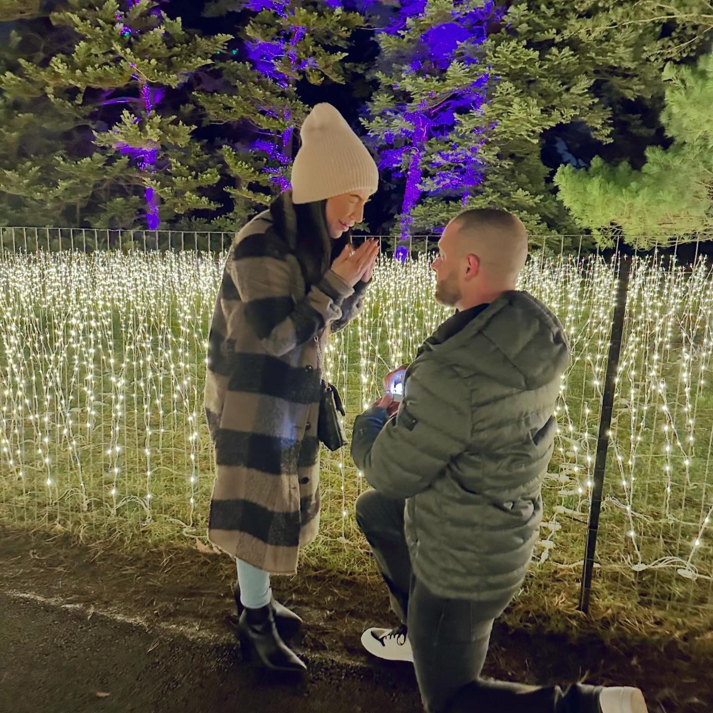 On December 9th 2023. Anthony took Nikki on a date to go see the Illumination Tree Lights at the Morton Arboretum and to her surprise, got down on one knee and asked her to marry him. She said YES!