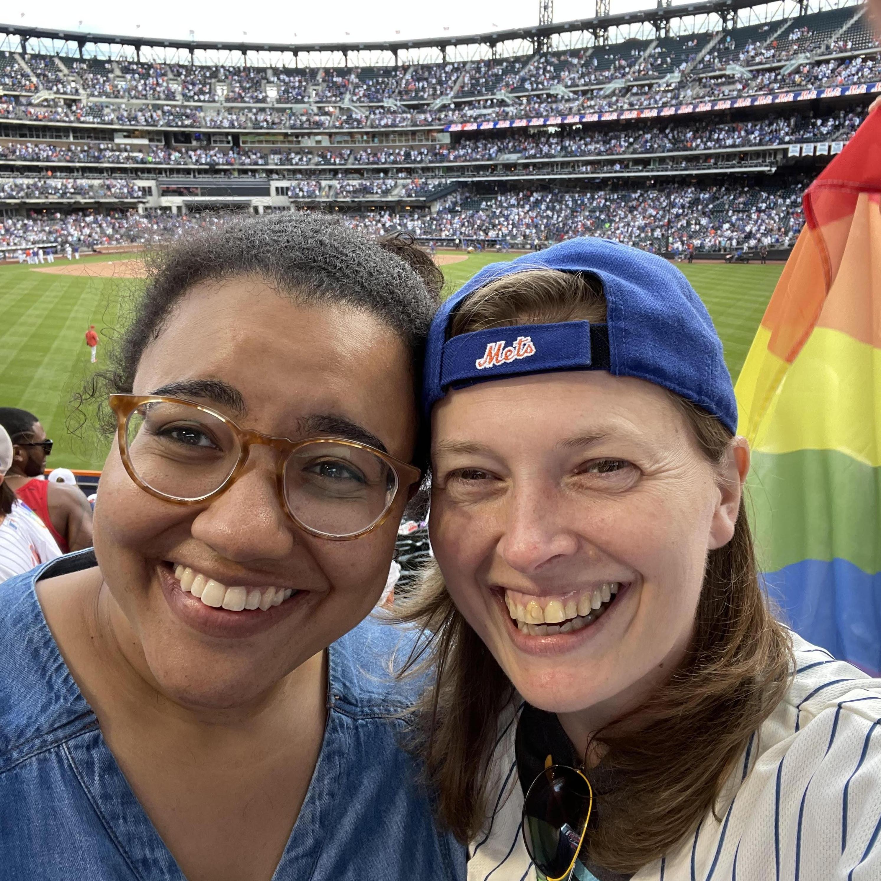 Camille and Megan love celebrating Pride. Here they are at Mets Pride Night in 2021.