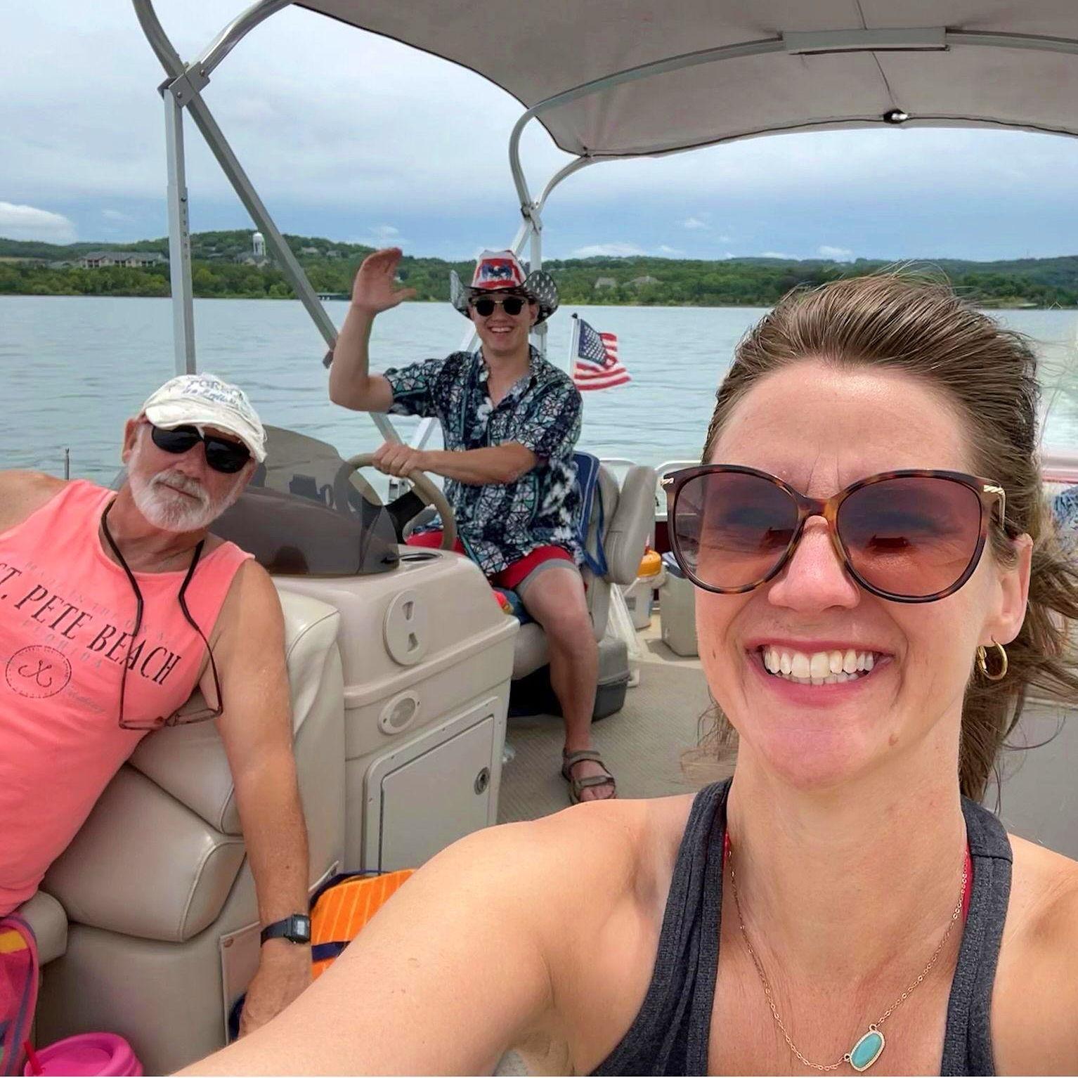 Ben captaining Jenny's family boat on Table Rock Lake. We love boating. Jenny's part amphibian.