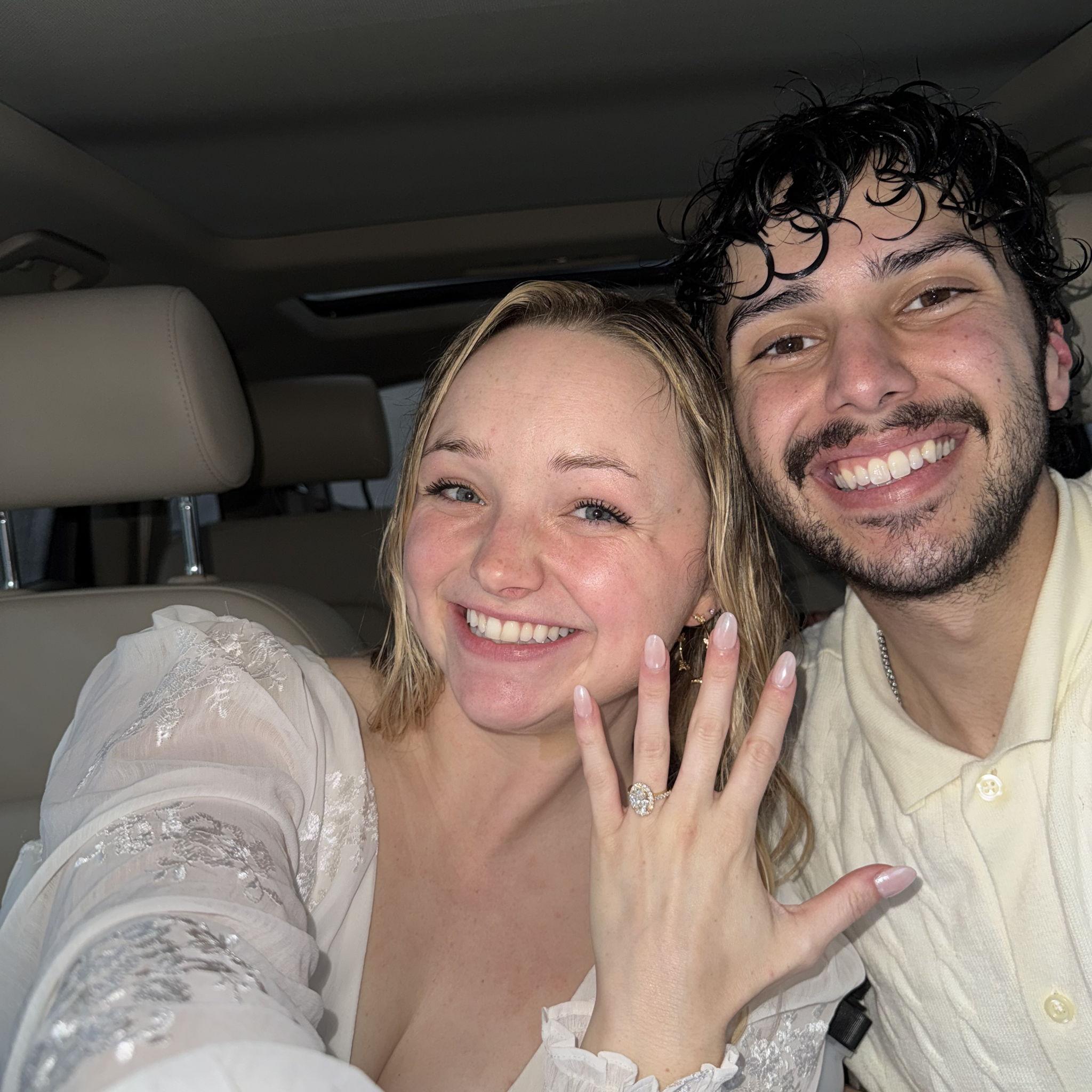 right after the proposal! both soaked from the mist on the mountain!