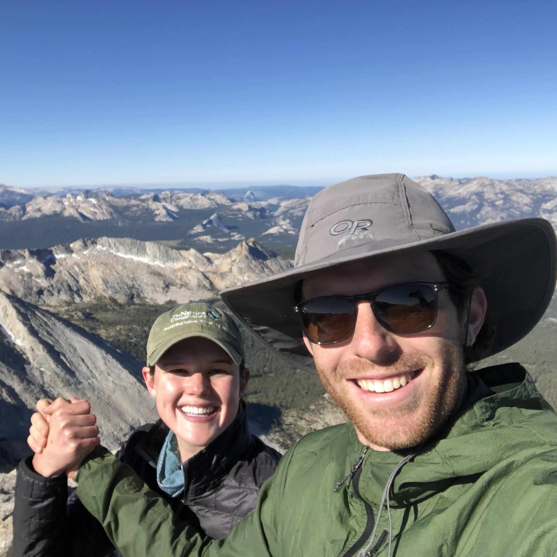 Triumphantly holding hands on the summit of Mt. Conness, a 12,590 ft peak in Yosemite National Park, in 2020.