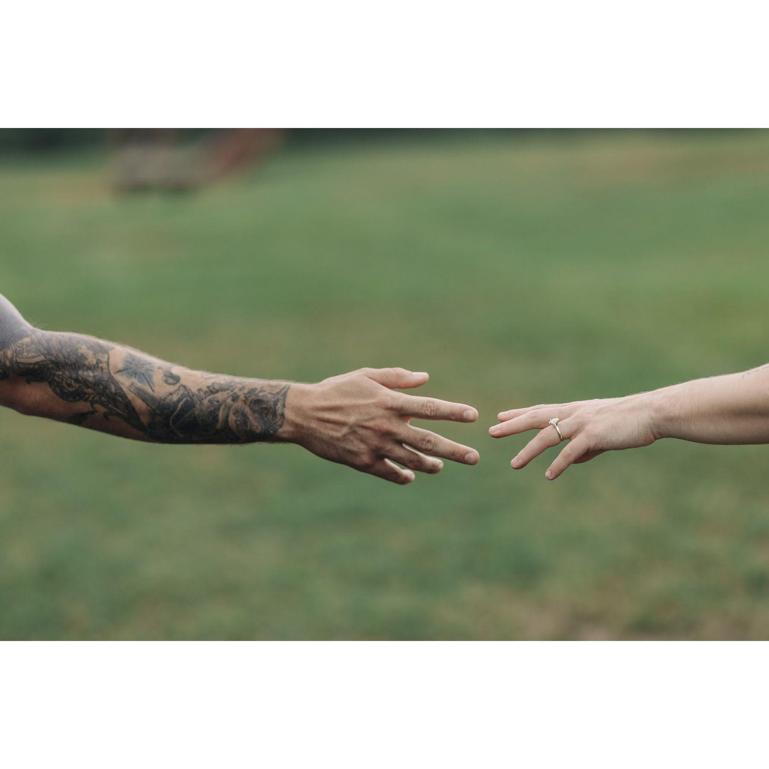 Engagement photos, reminiscient of the Creation of Adam