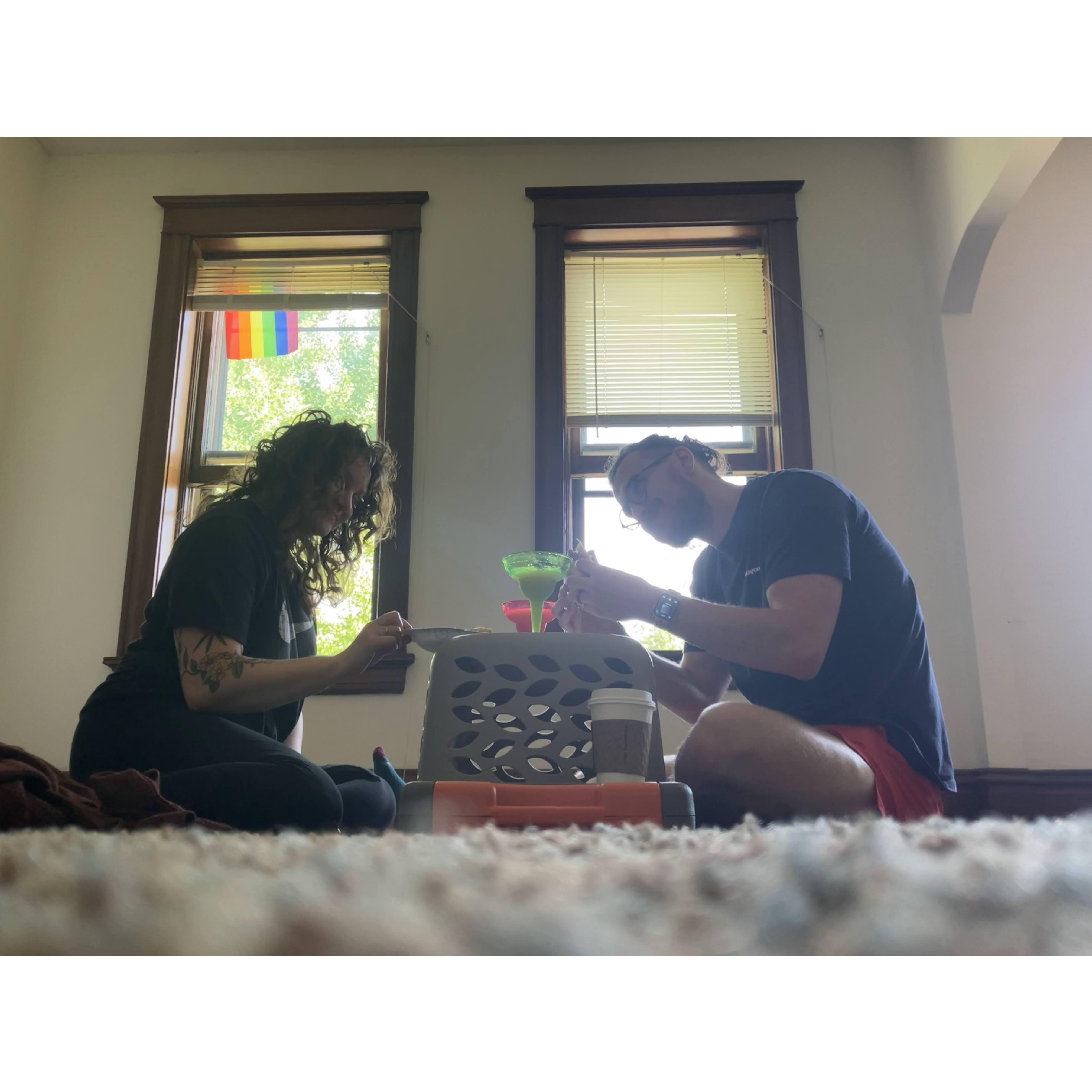 Our first meal in our first home. Laundry basket table.
