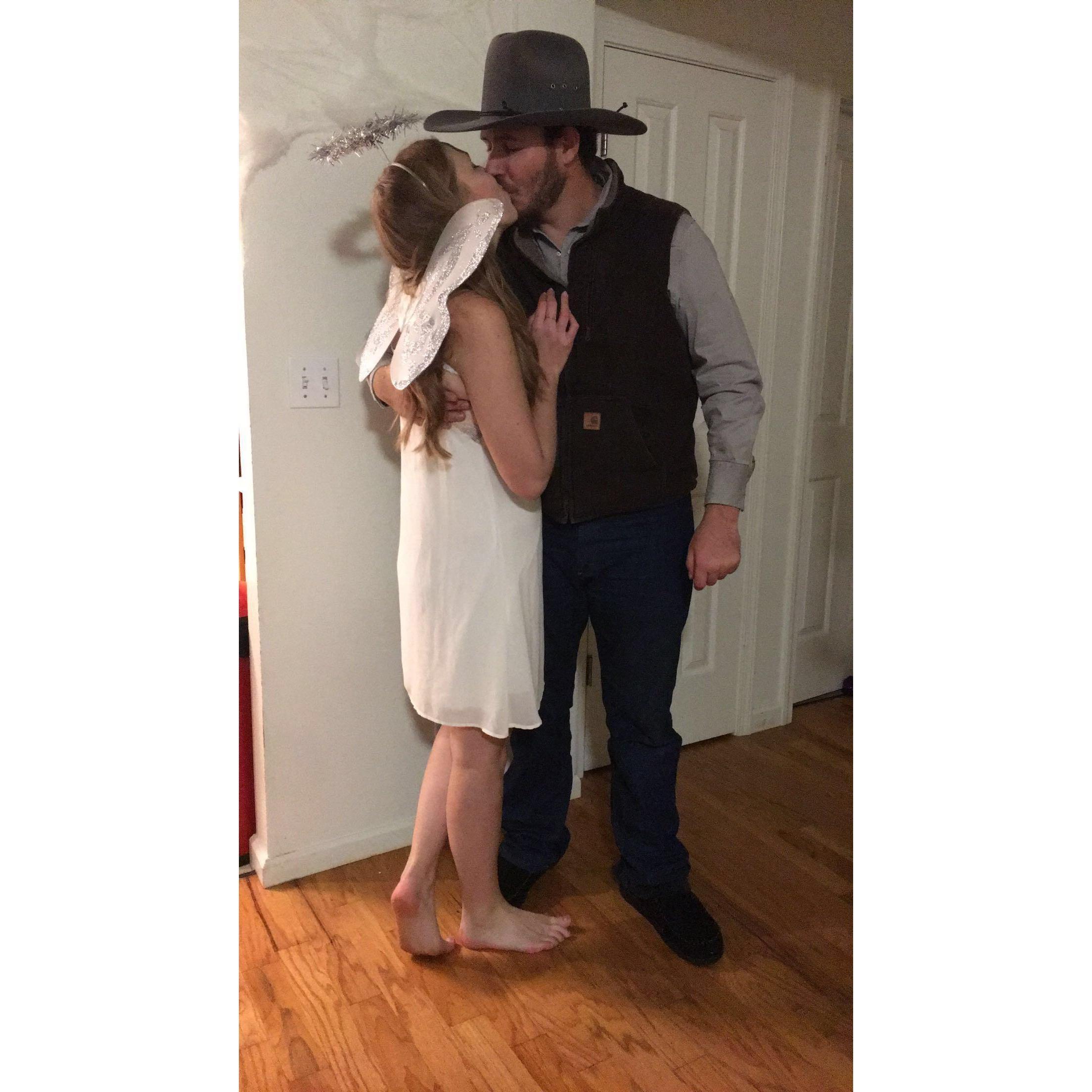 Our first Halloween party in our home. He was the cowboy to my angel!