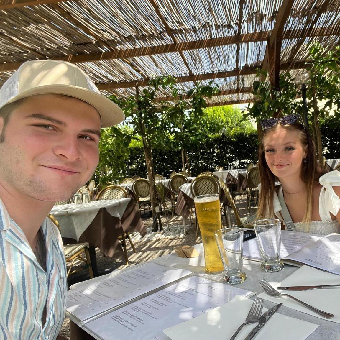 Us in Italy getting pizza, peroni, and peach wine for the first full day we were there!