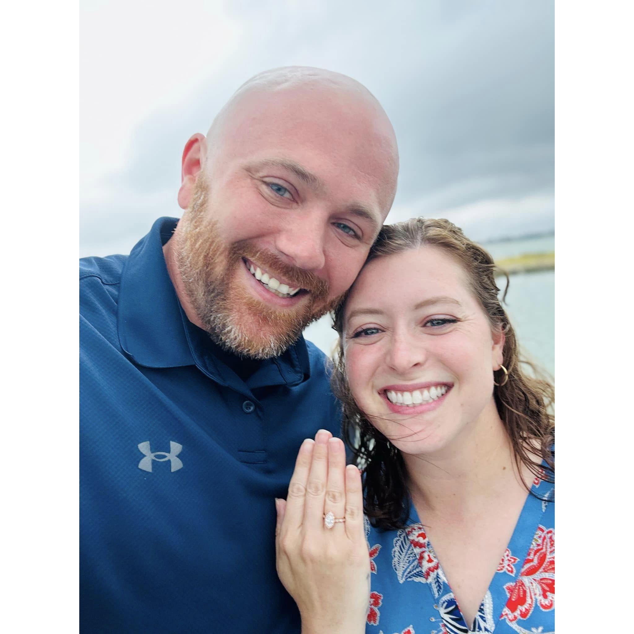 Ryan proposed to Ashley on July 15, 2023, near the lake with friends and family close by!