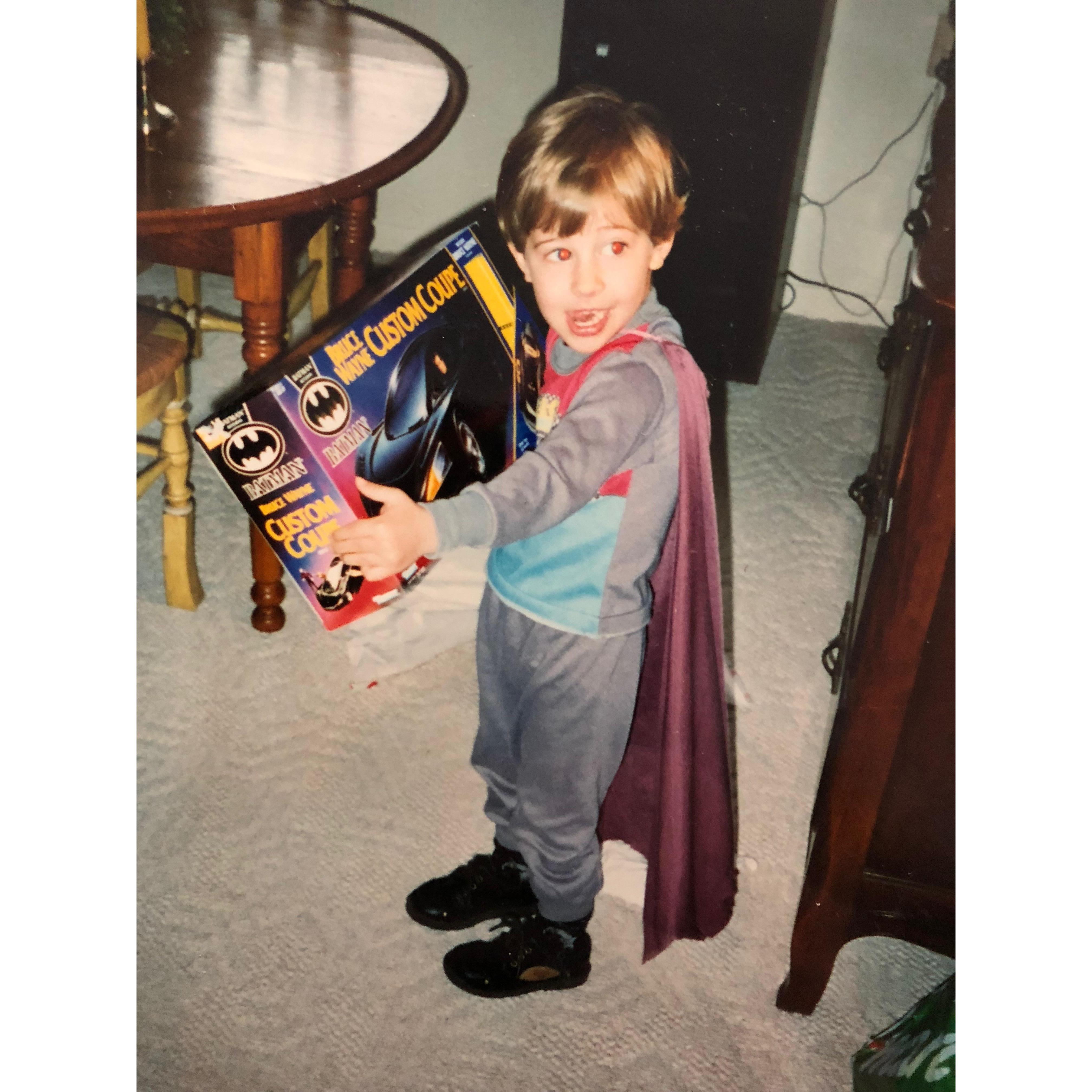 Cameron likes Batman. He used to have a super dope cape that definitely was not a repurposed disco skirt from his aunt.