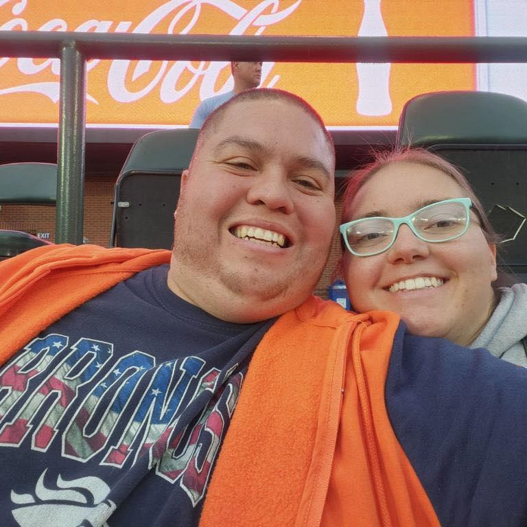 Spending time with family at a baseball game.