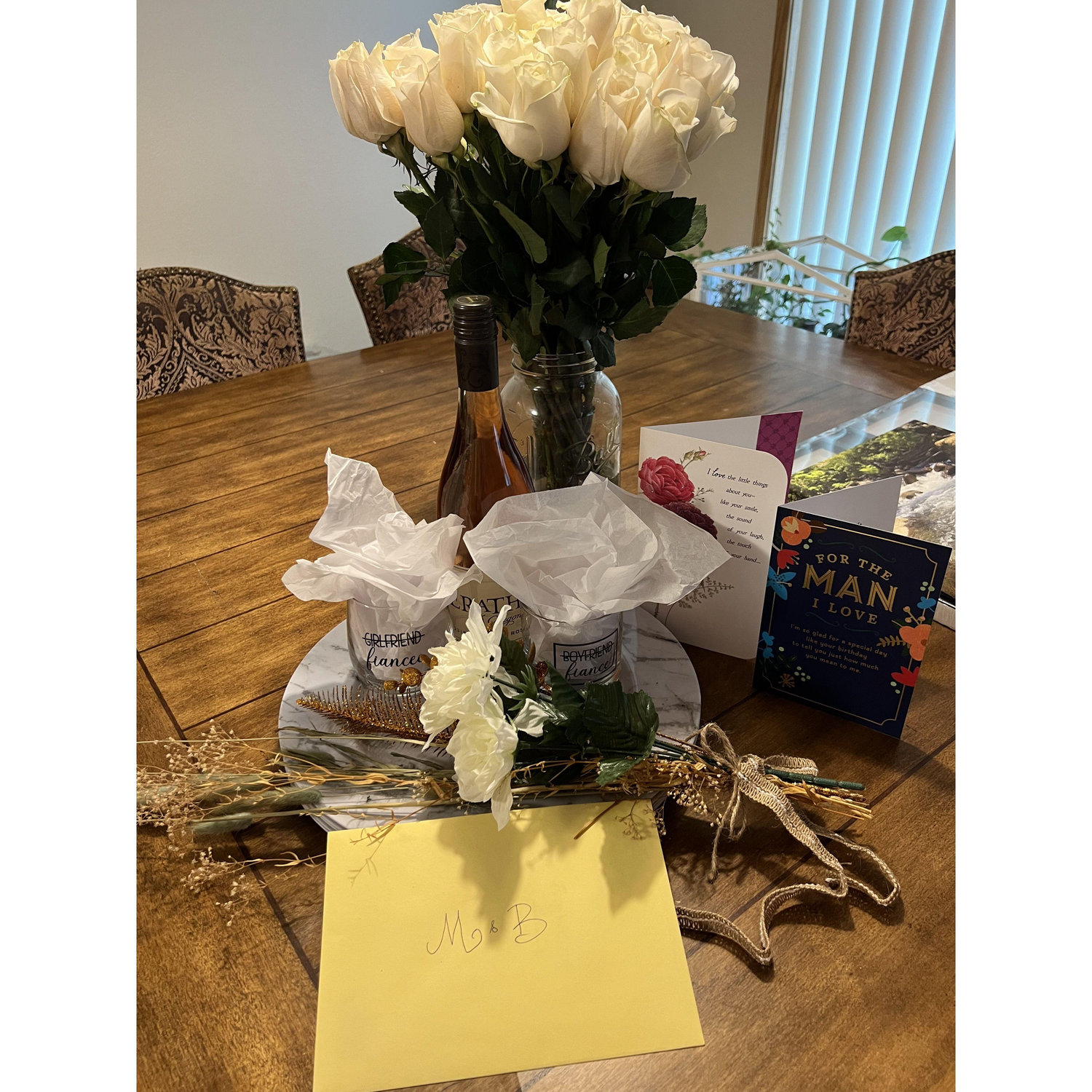 When we got home from our love-filled anniversary, Molly's mom had decorated the whole apartment! Balloons, confetti, pictures, and wine to celebrate the engagement