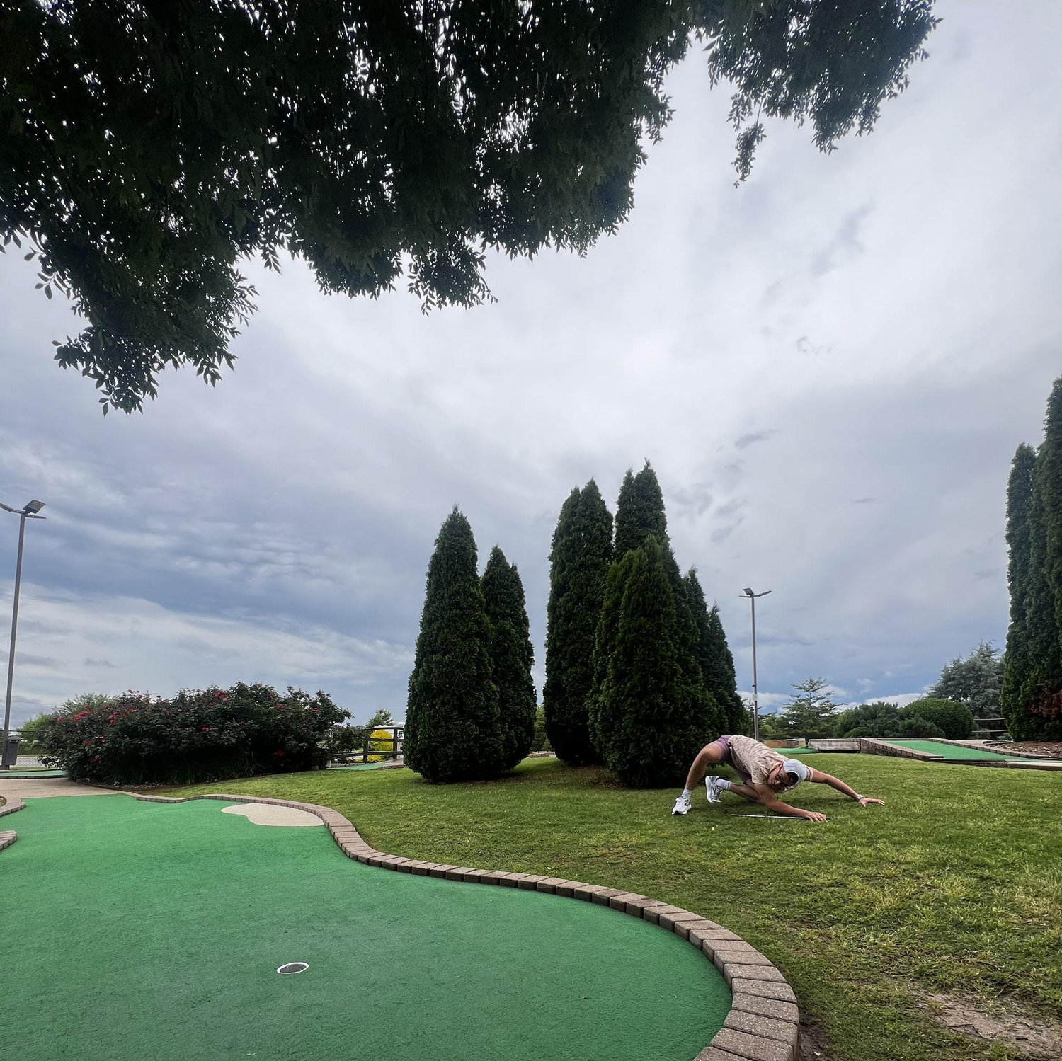 The deal was whoever lost mini golf had to pay for dinner. Even with his fancy aim techniques… he still lost