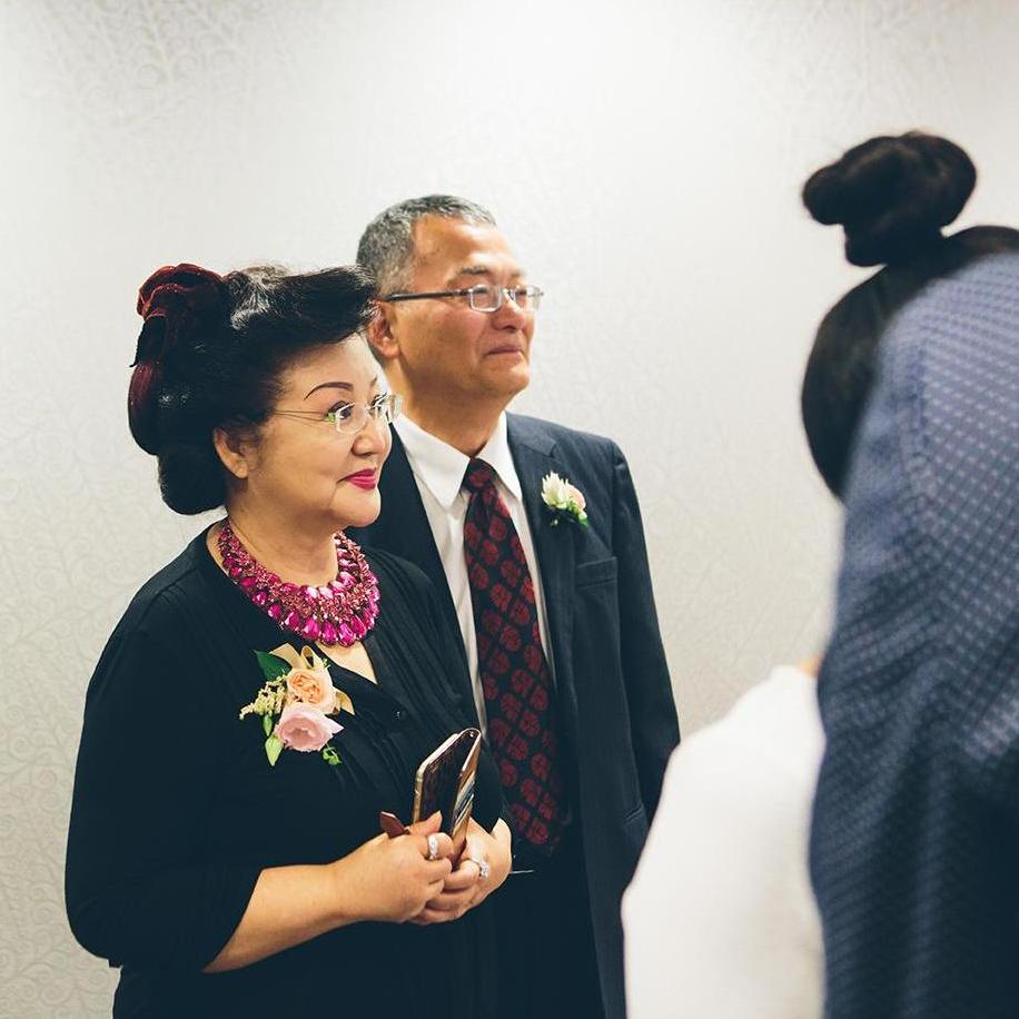 Parents of bride during vow exchange
