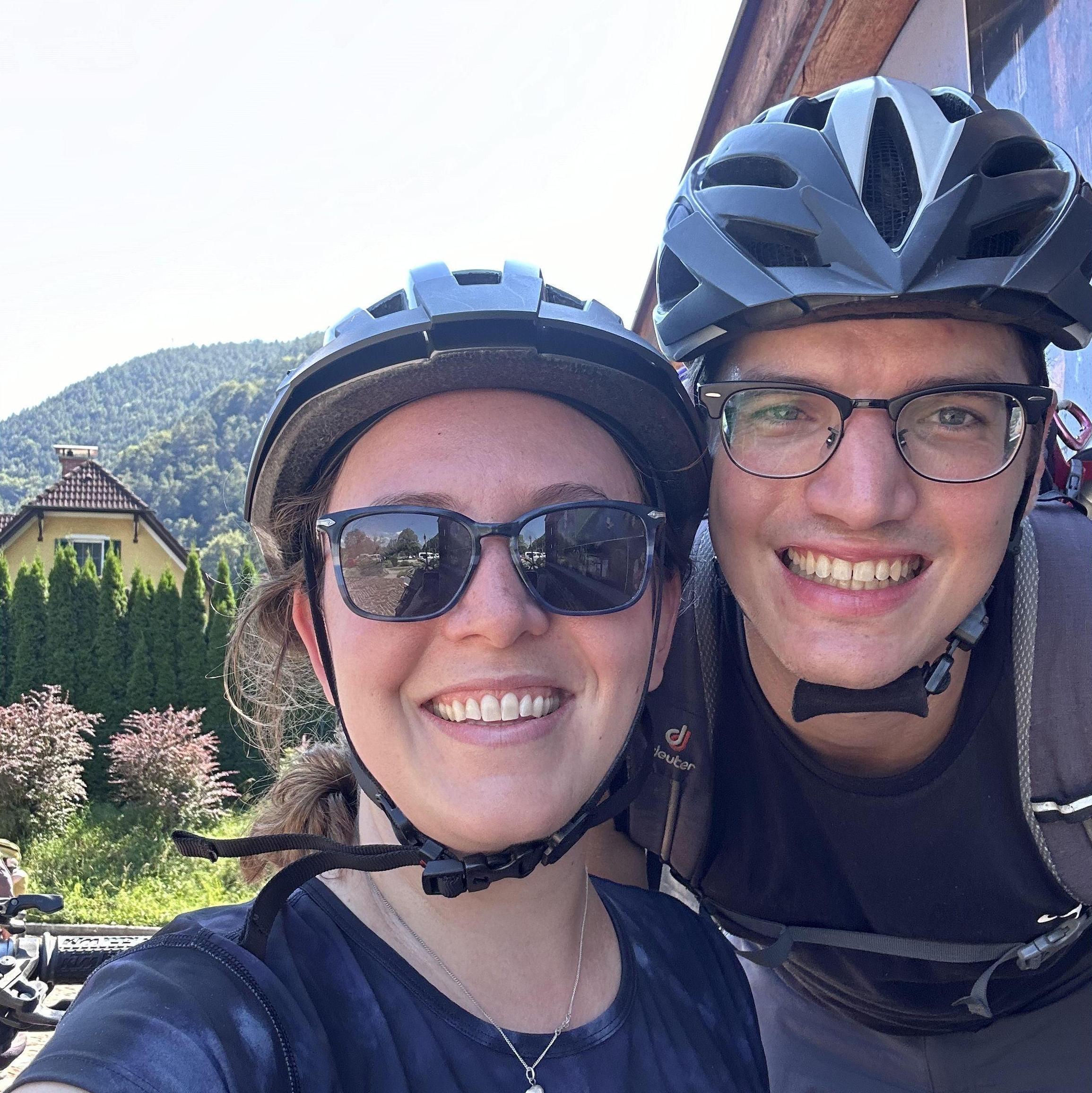 After a (50 mi!) bike ride in Austria, 2024. Stefan's love of biking is (slowly) starting to rub off on Claire.