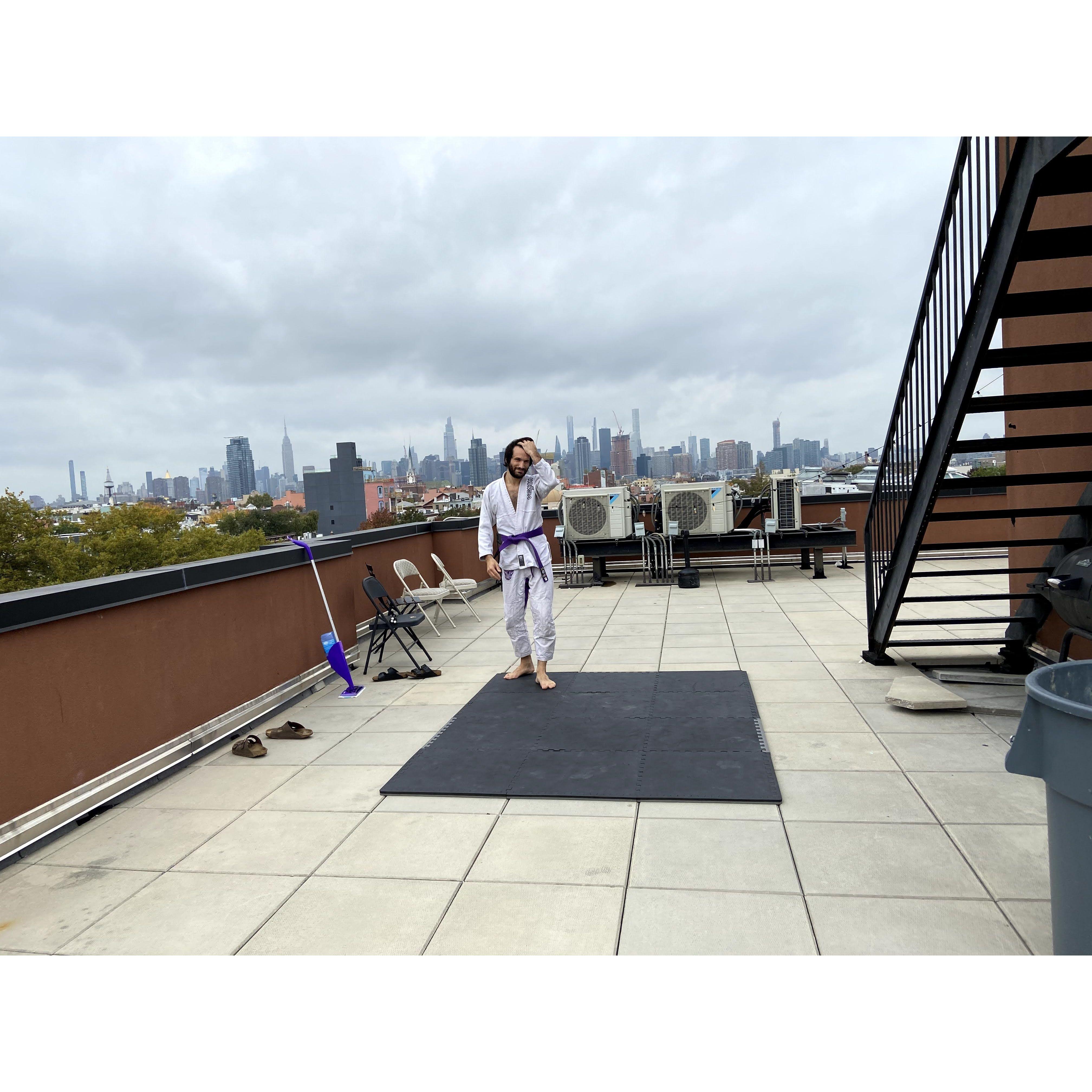 When we moved in together, we started bringing our mats to the roof for the city view backdrop