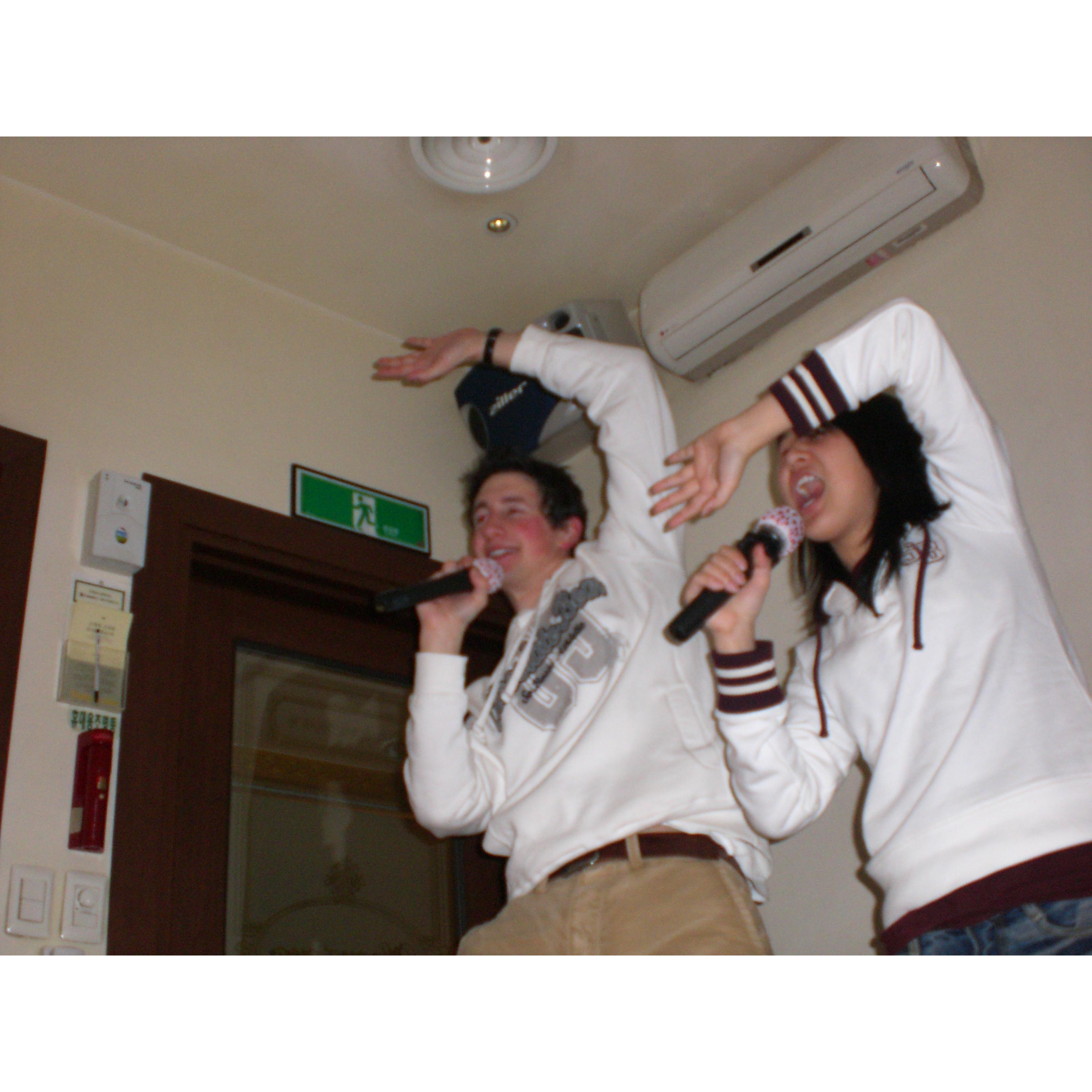 Tom visited Jung when she was studying abroad in Korea. This photo is a from a noraebang (karaoke room). Totally an unplanned and coordinated moment in the midst of singing "Everybody." (Korea 2007)
