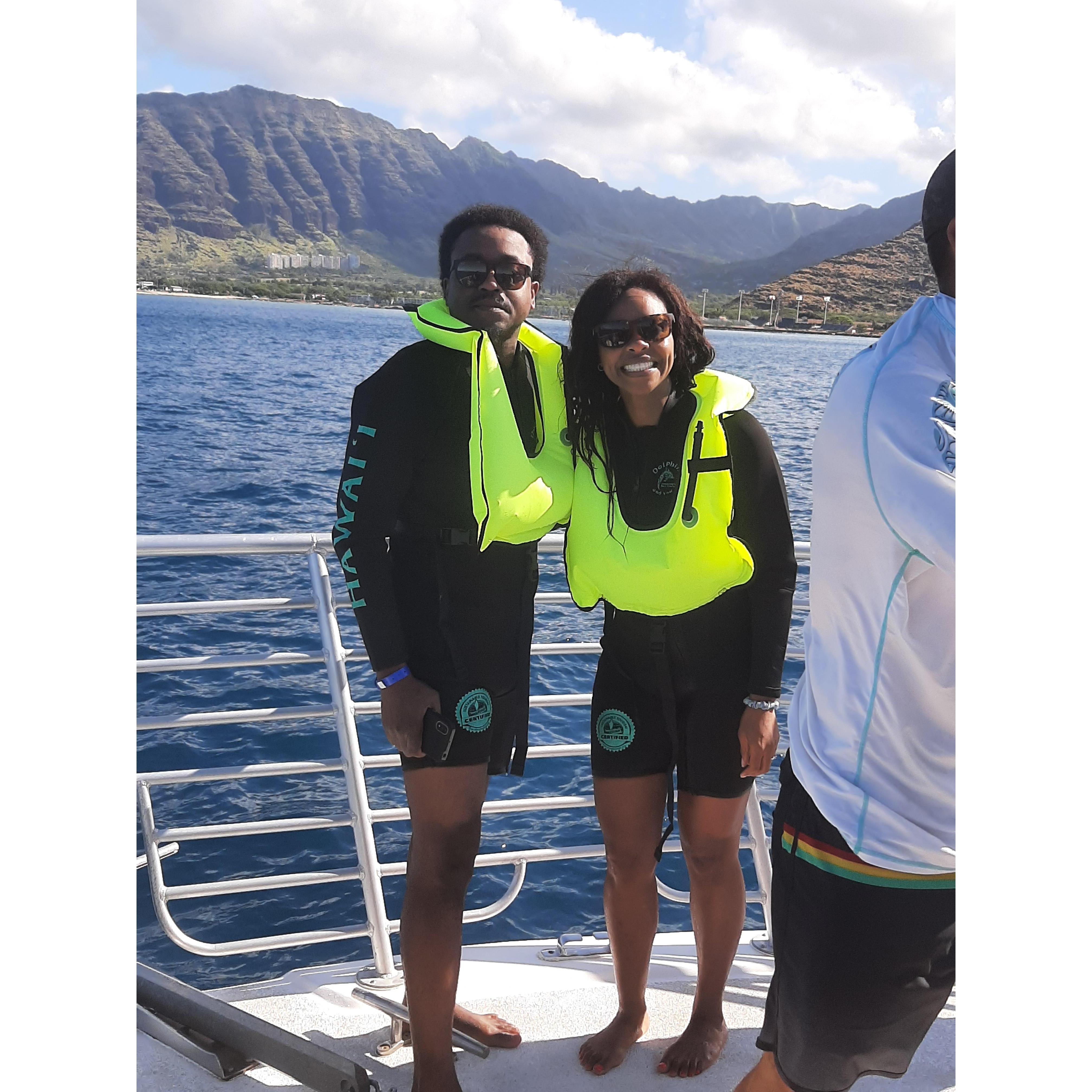 Having fun swimming with dolphins in Hawaii with my lil 'bro