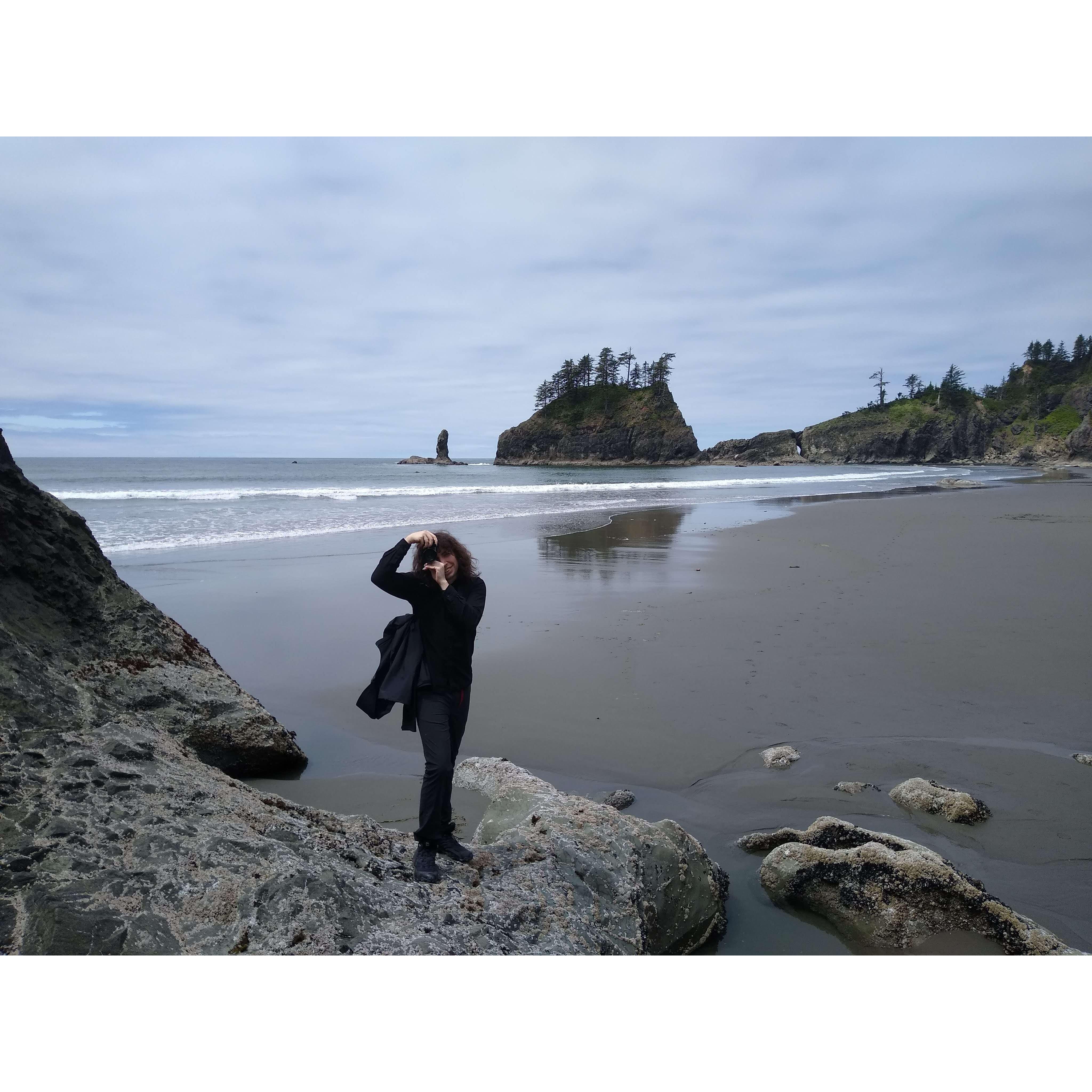 Rex taking a photo of Yara taking a photo on Third Beach