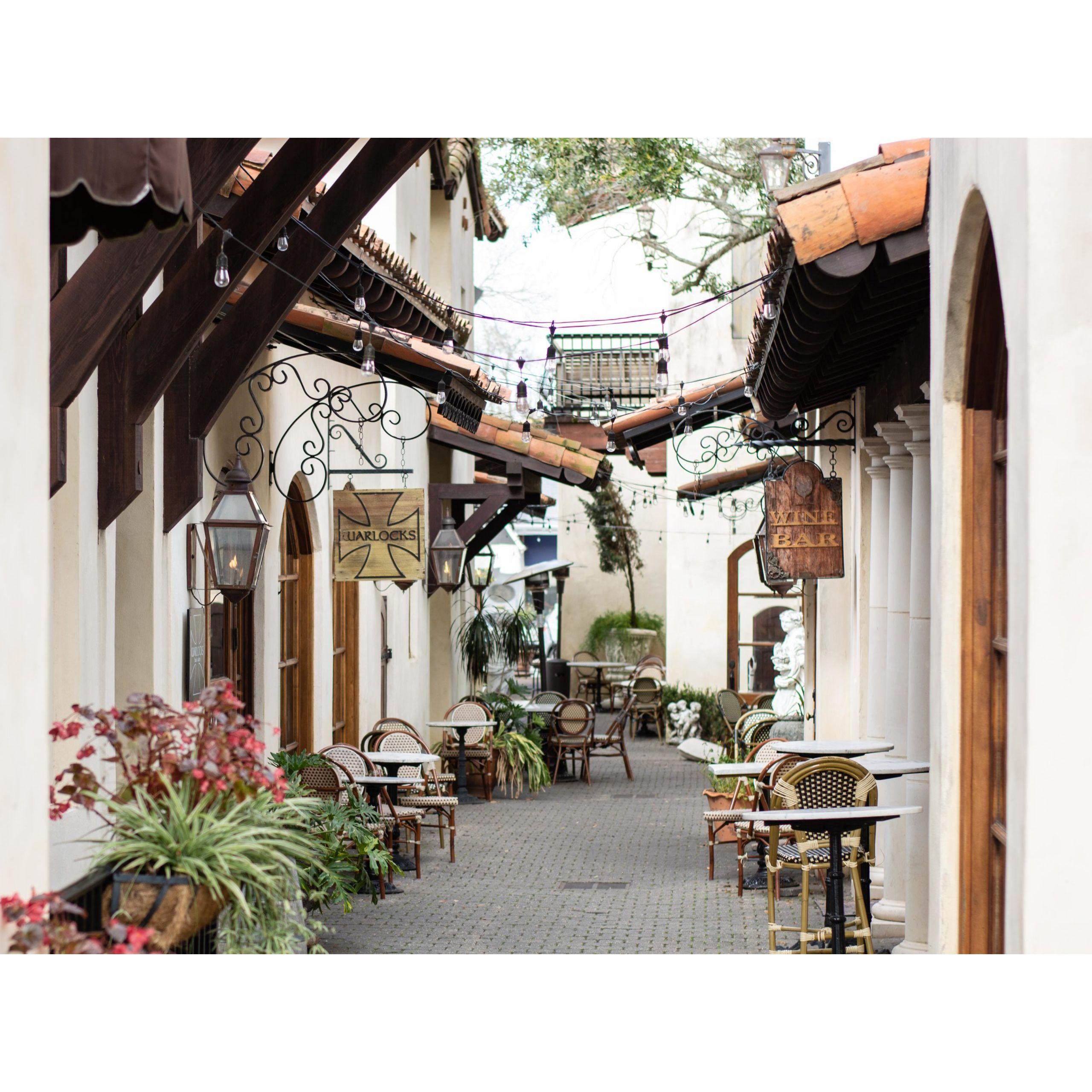 Charming shops, salons, and a wine bar flank this European-inspired alleyway.