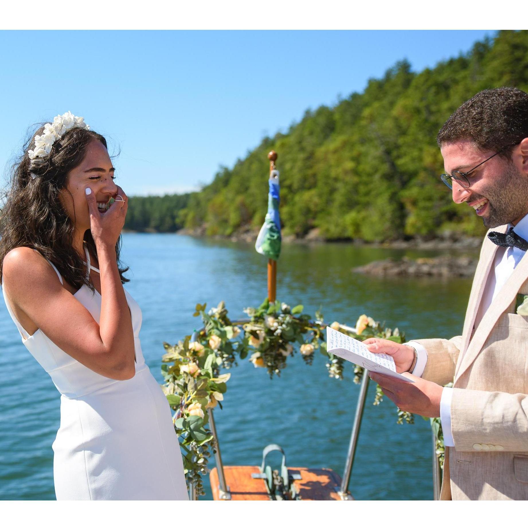 Pierre reading his vows to Alisar during our boat ceremony.