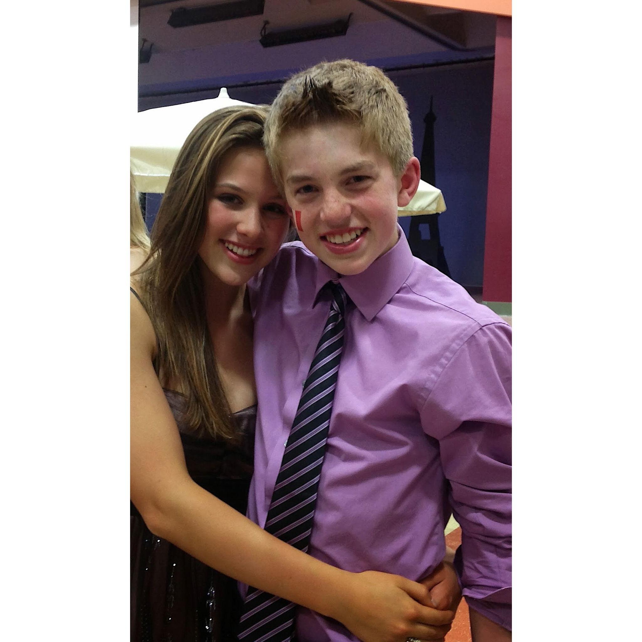 Rory and Maya all dressed up for 8th grade banquet. (Maya was bending down so that she wouldn't be taller than Rory in this photo.)