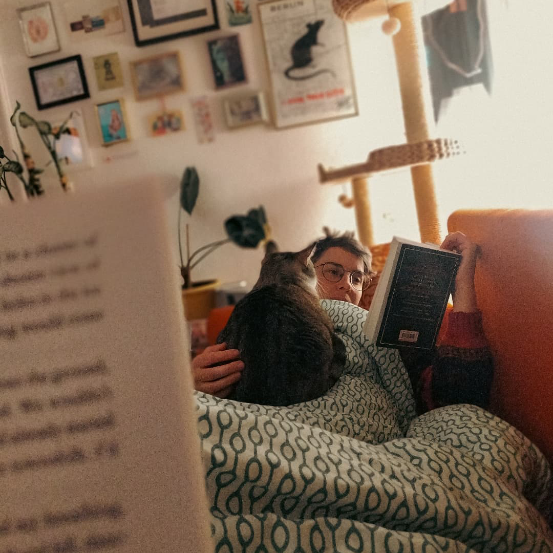 Just a cozy evening at home. Tommy always takes turns cuddling with us—he does his best to be very fair with his cuddle time.