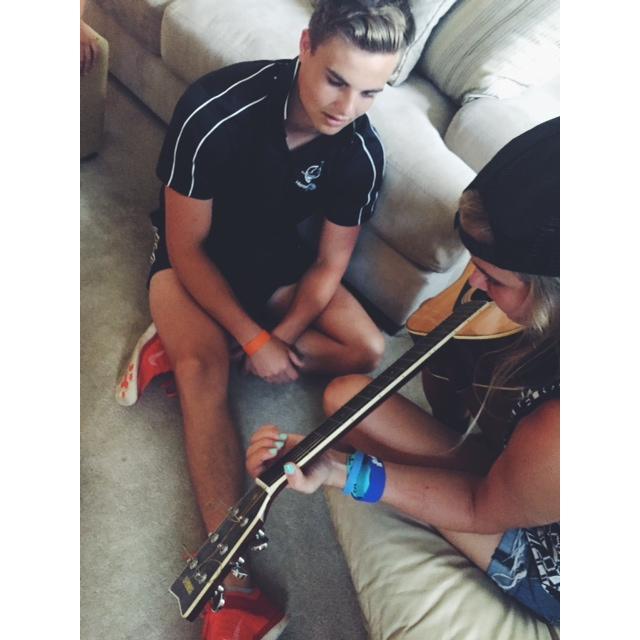 Teaching me how to play guitar the year we first met;)