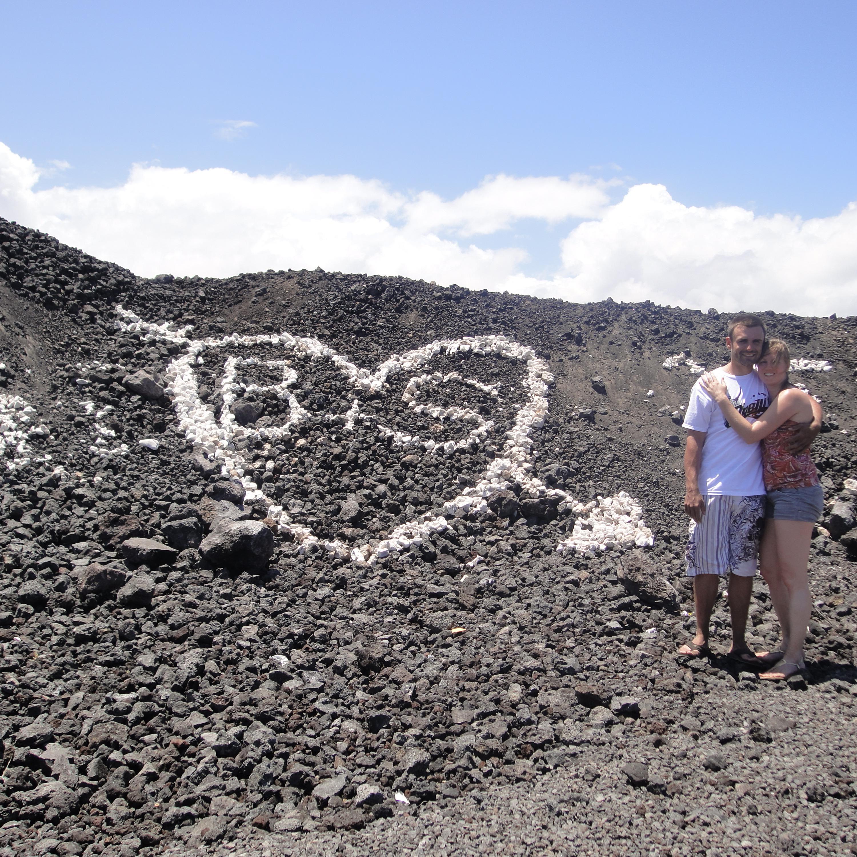 On the Big Island of Hawaii, announcing our love to the world. Or really, just people driving down the highway. This highway is full of white pumice stone to decorate the sides of the road.