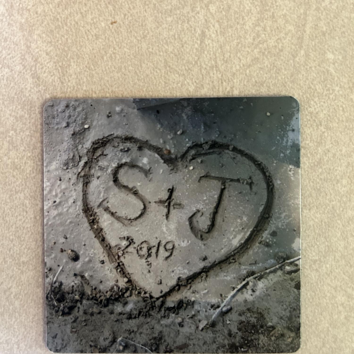 Scratched into the cement.