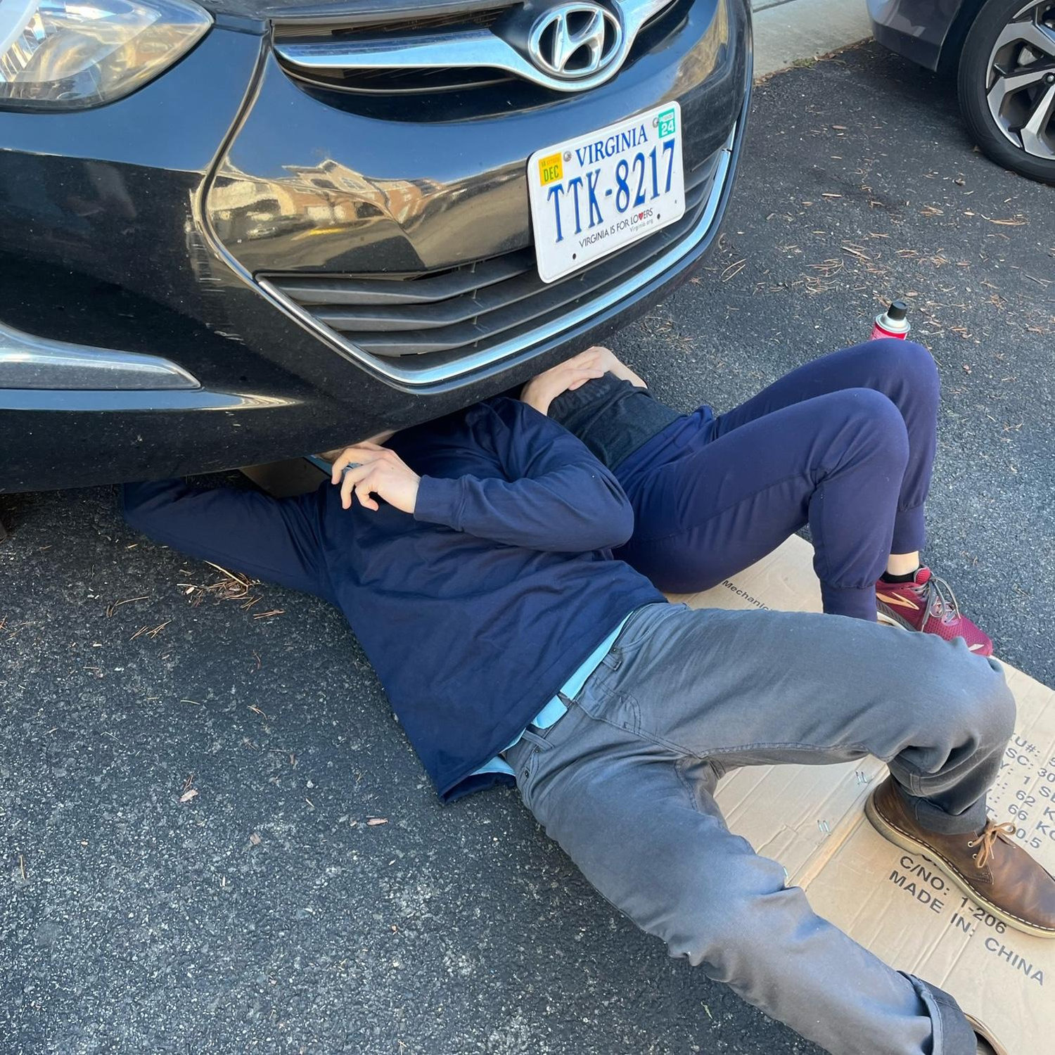 Charlotte takes a nap while Jon changes her oil