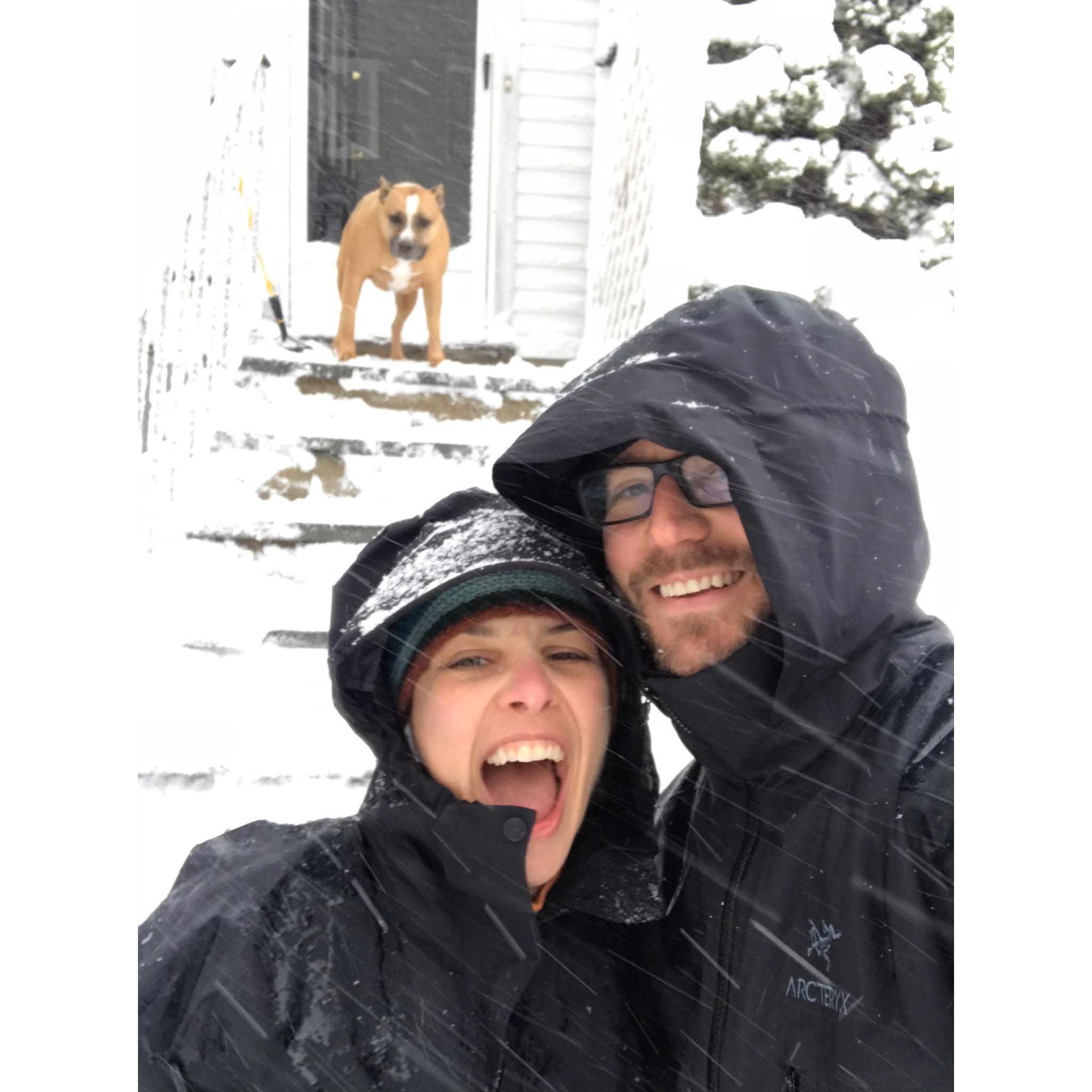 Two out of three in this photo are excited about shoveling snow.