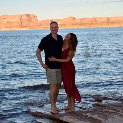 Dani looking beautiful on the shore of Lake Powell, Kyle looking happy on the shore of Lake Powell.