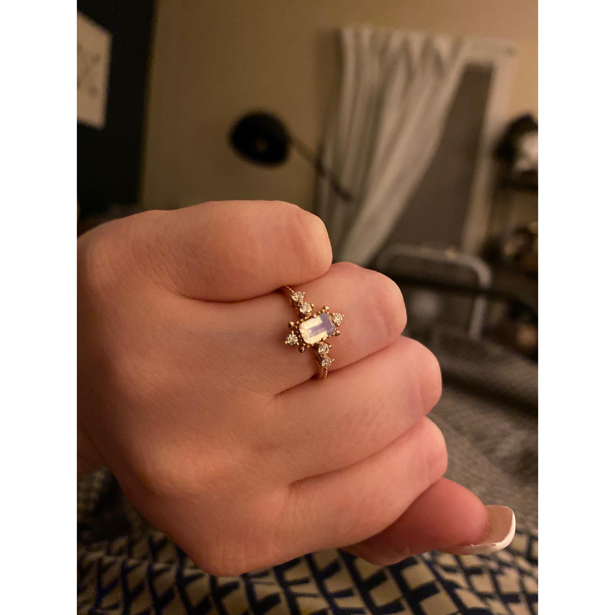 People keep asking to see the ring so here is a close up. It is Rose Gold, Moonstone and Moissanite.