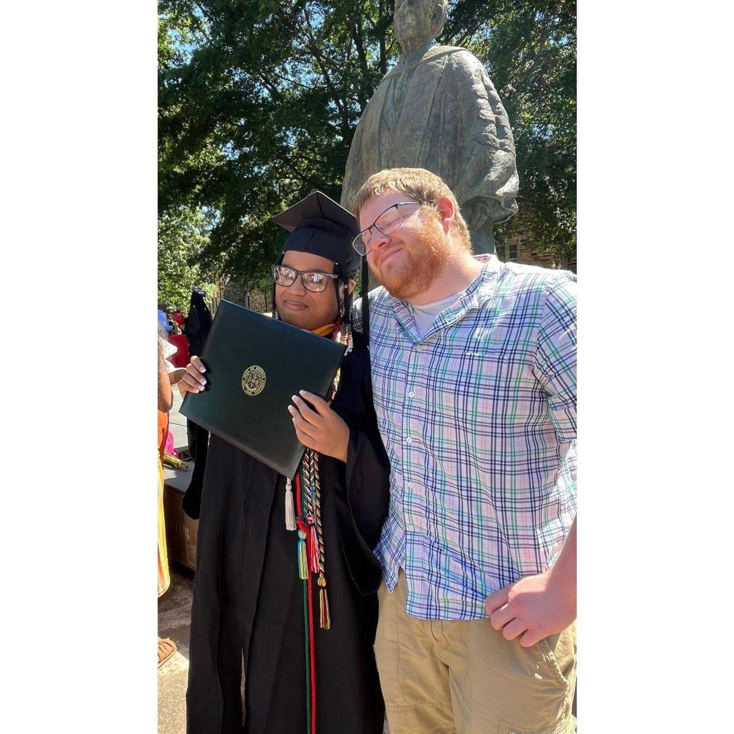 Max was one of the first people racing to get a picture when Jewelle graduated from Rhodes College.