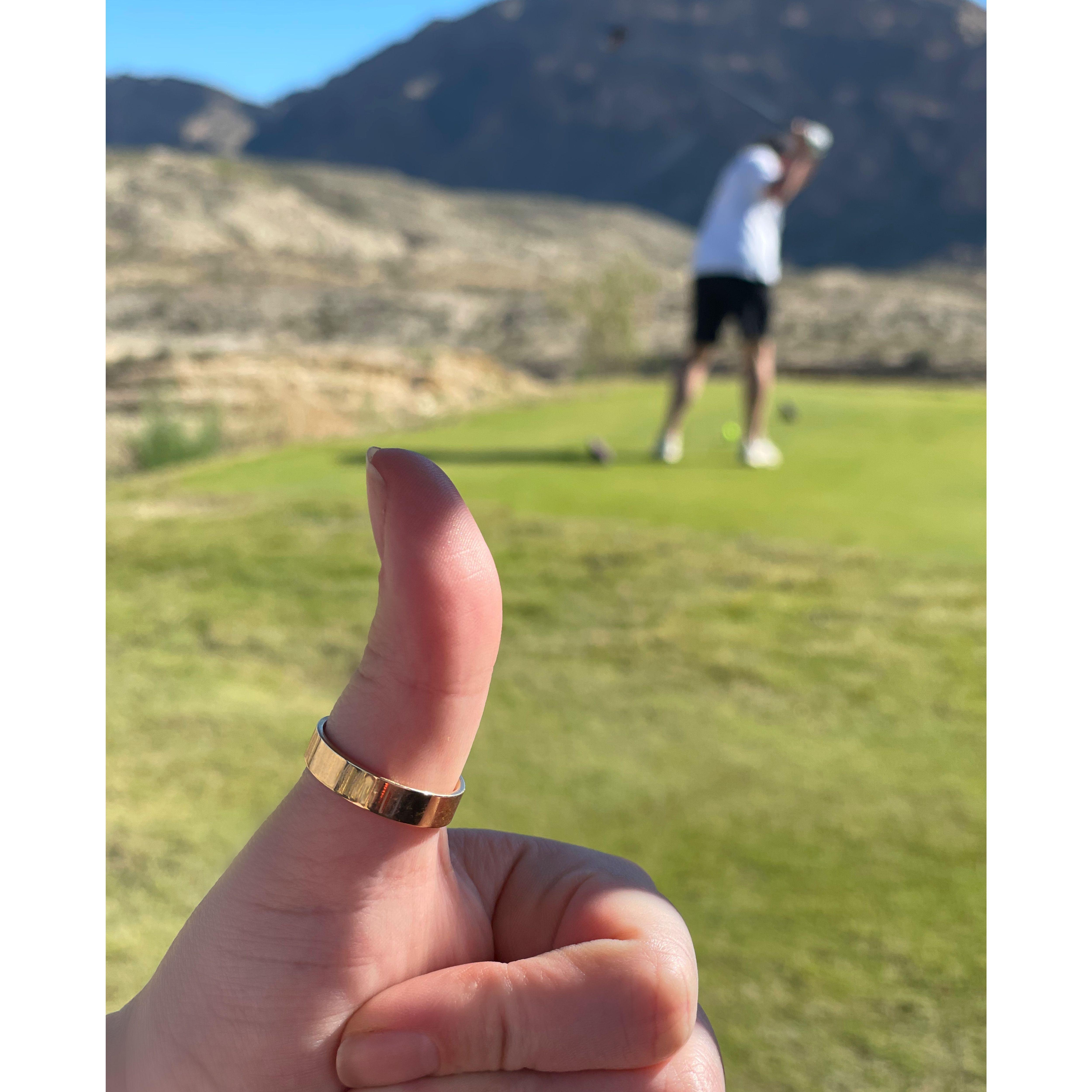 Golf the day after our wedding, thumbs up for best wife award and keeping that new band safe.