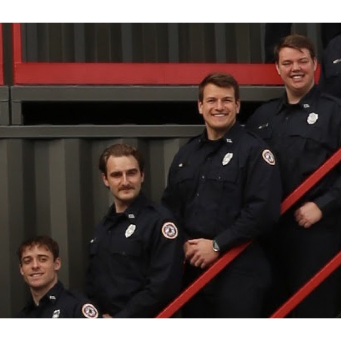 Garrett with Jeramie, Ben, and Guarino after graduating from the fire academy