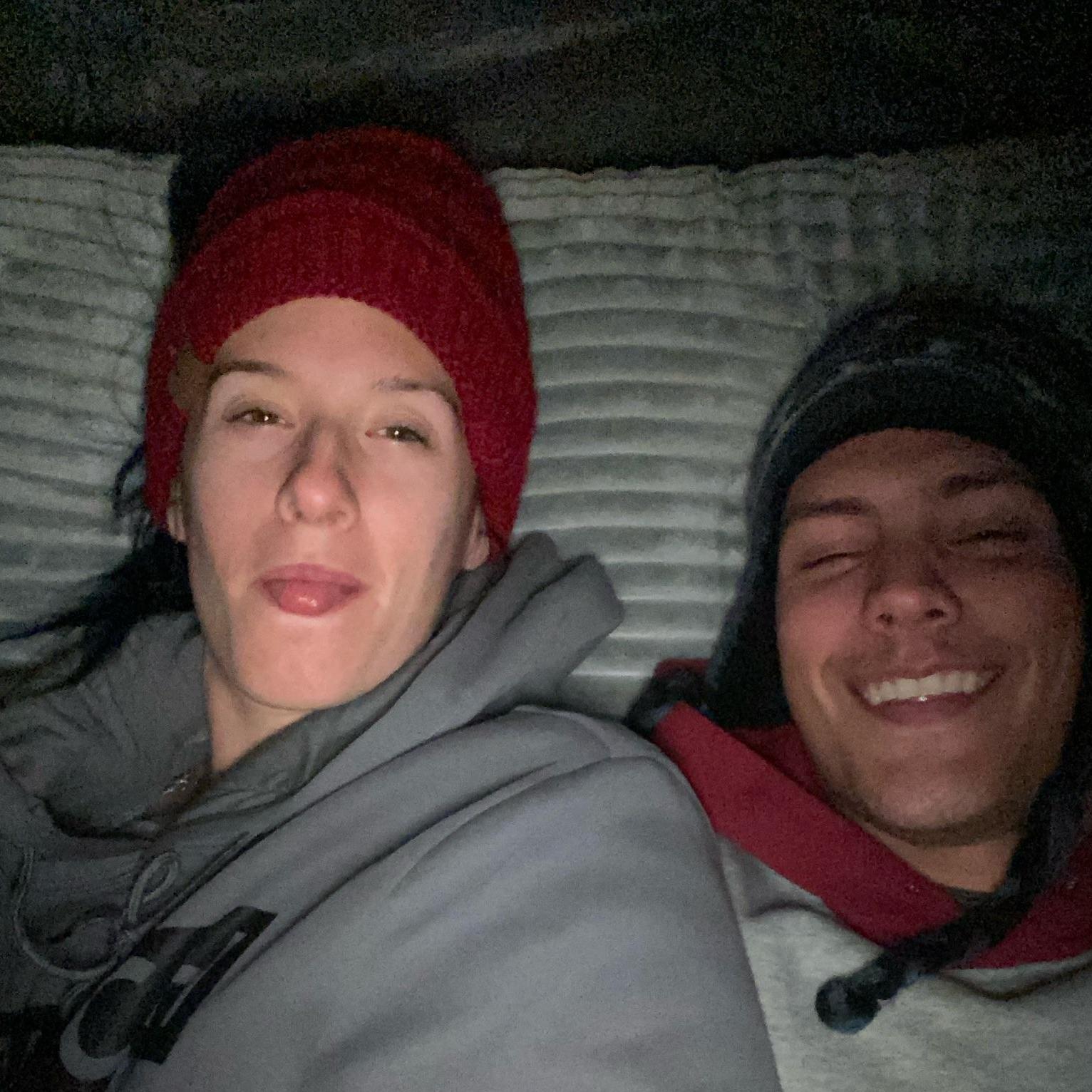 Snuggled up on our first camping trip in October 2020