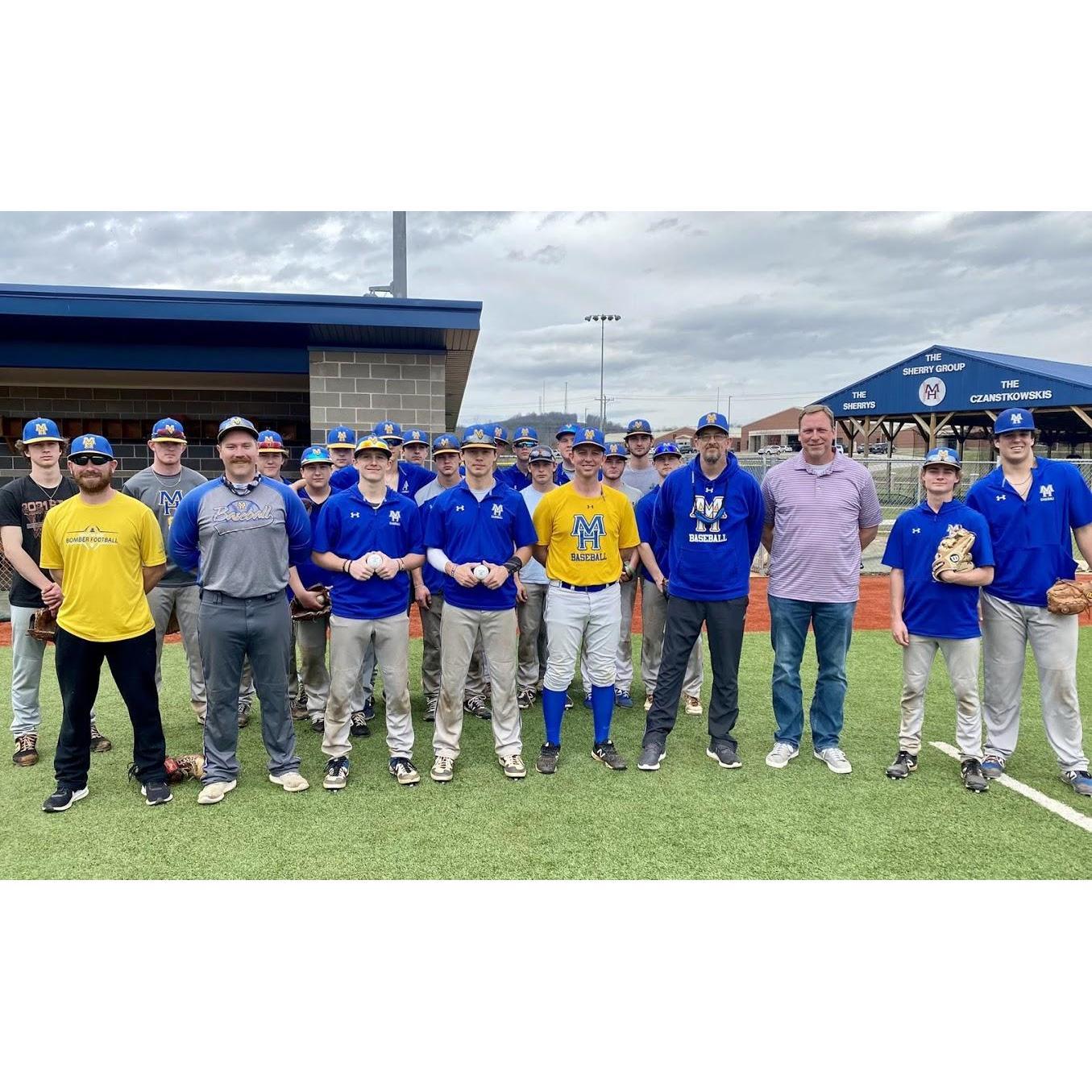 Kyle with the baseball team and coaching staff.