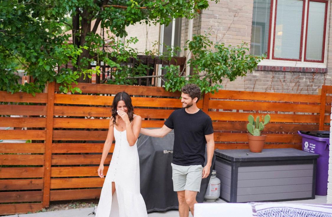 Our entrance into the surprise engagement party with all of our friends,