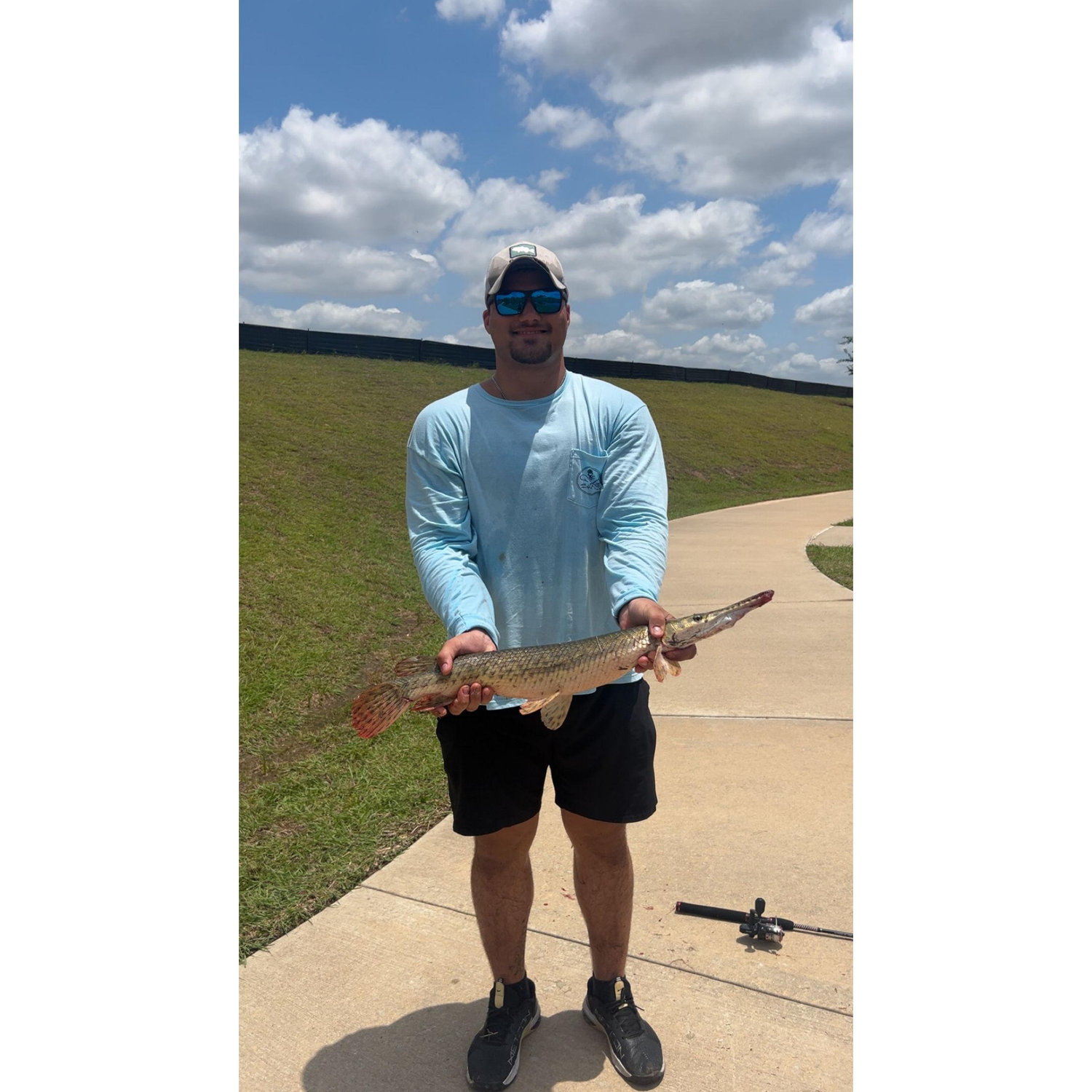 Bill soaking up the sun and catching some gar with Liv!