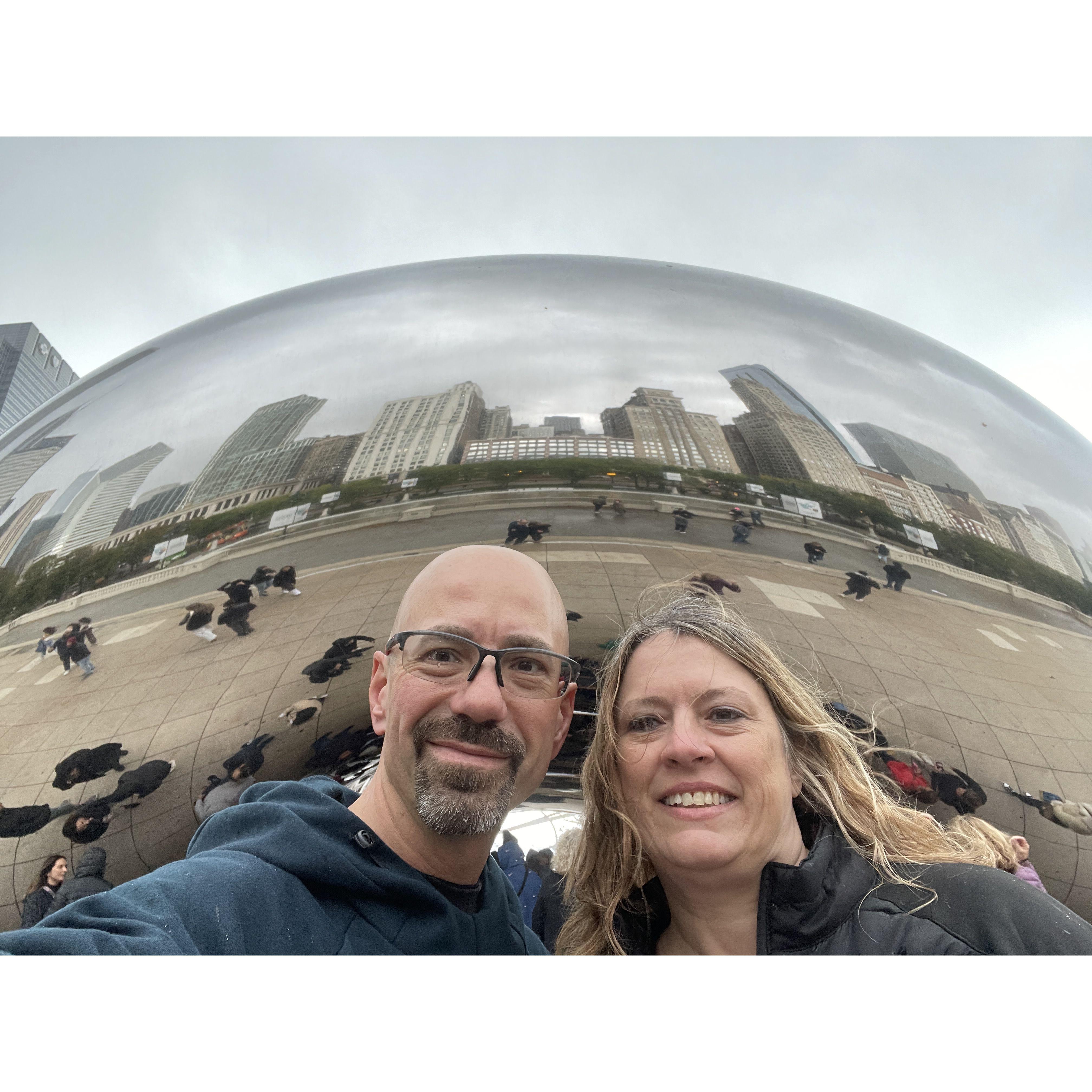 Great picture of us and the Chicago skyline on "The Bean" after a rainy & windy day doing the 5K Hot Chocolate Run.