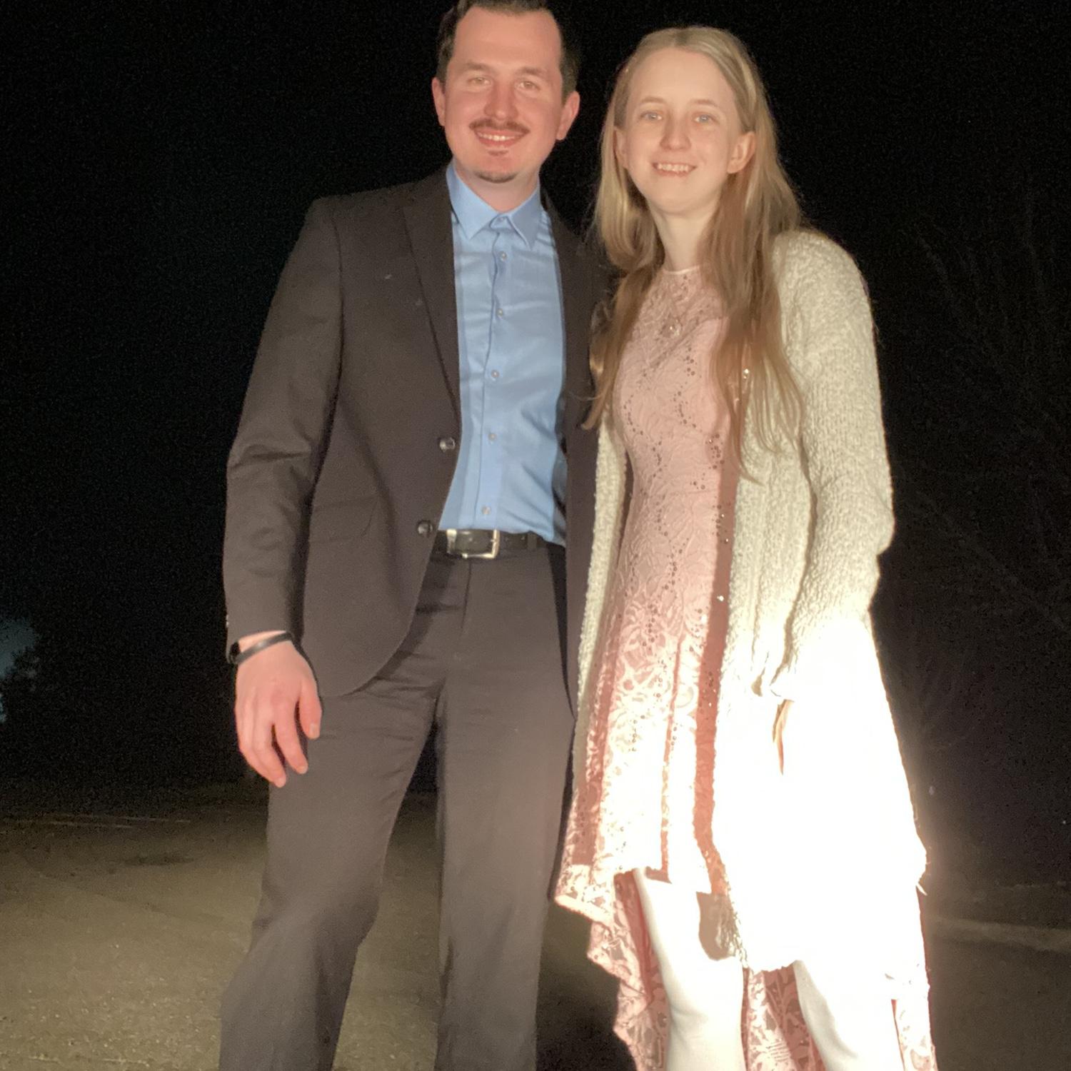 Adventure Challenge date dressing up in prom clothes and dancing in a parking lot