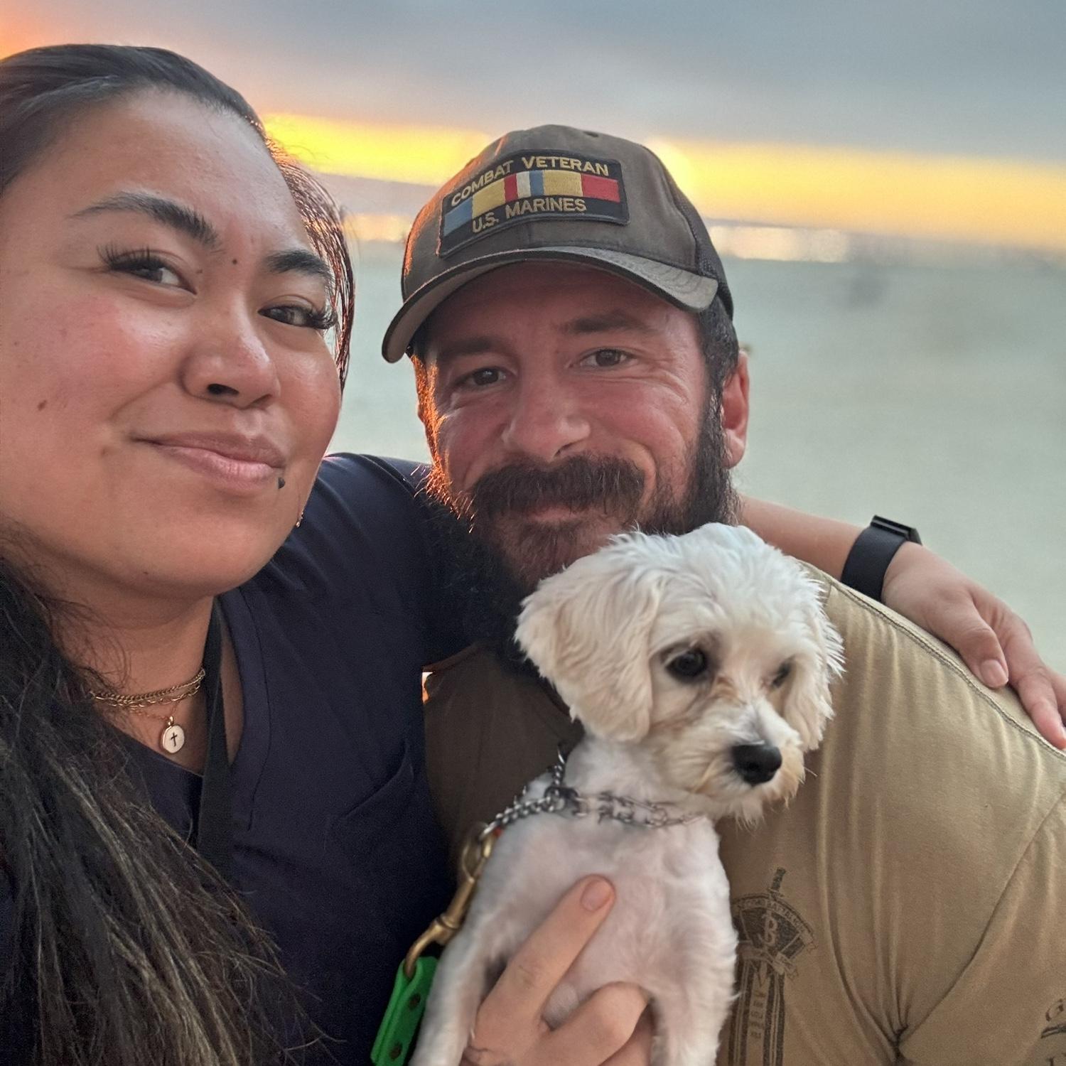 With our fur baby, Malachi 💚