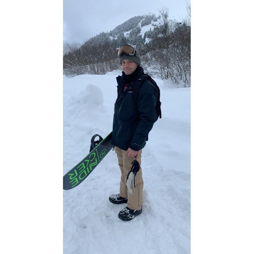 The snowboarder.