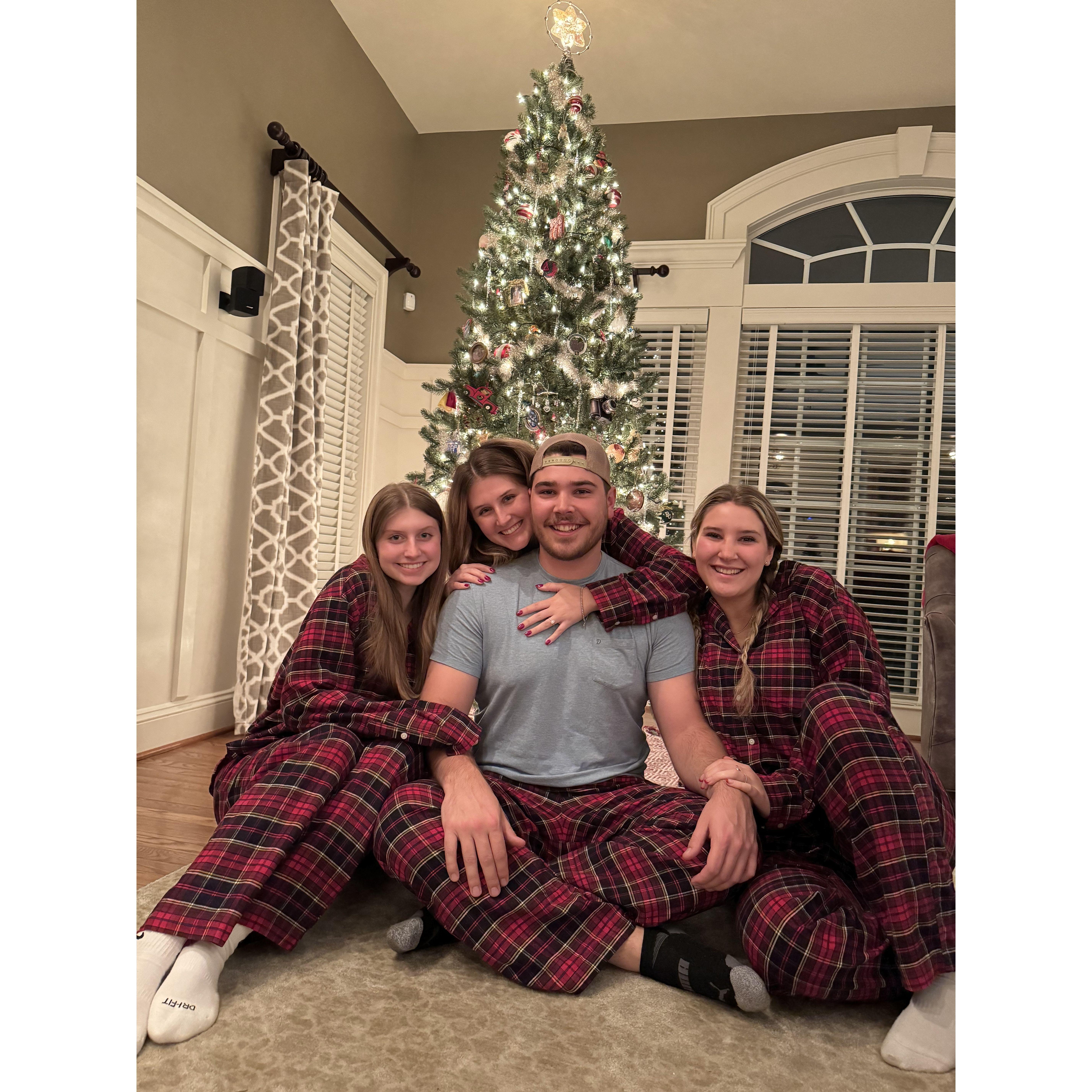 Matching Christmas pajamas with our sisters.