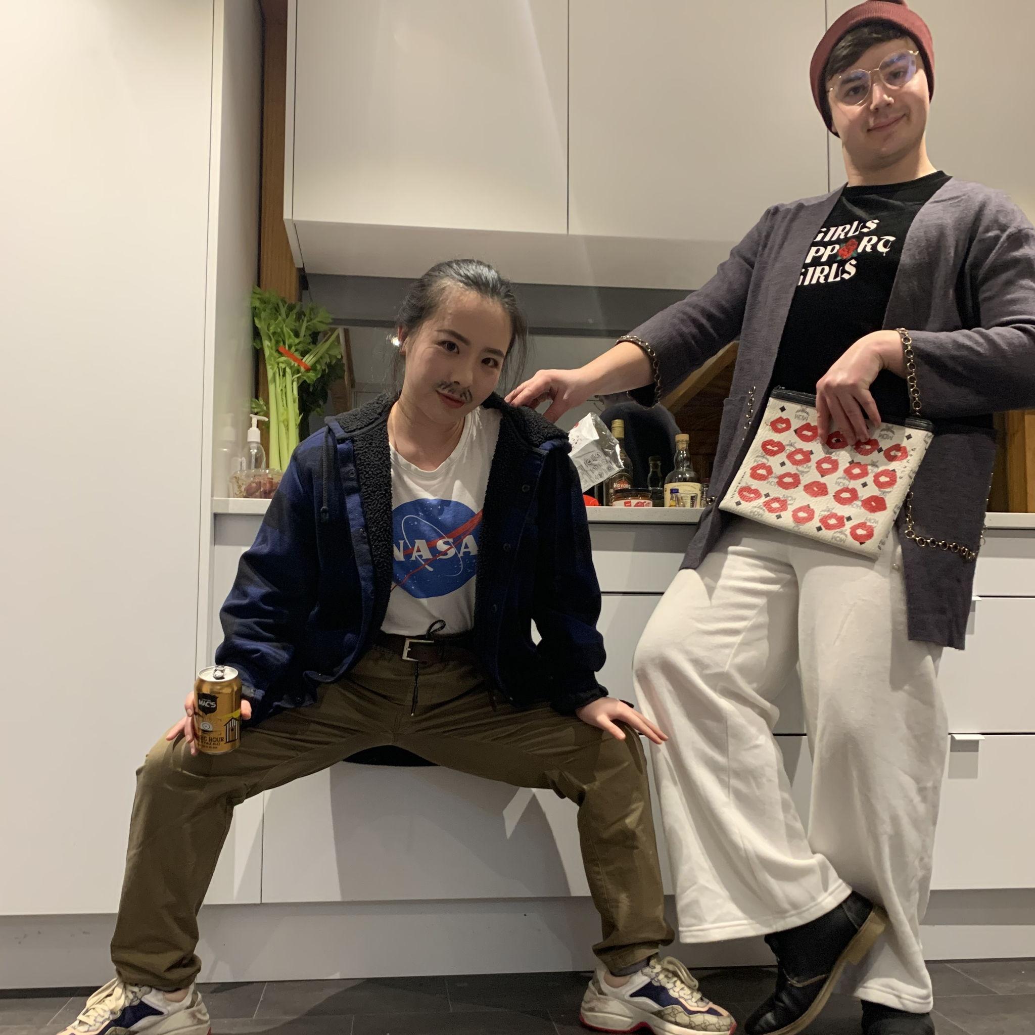 June 2022, Auckland - At the house party where we had to switch wardrobes... who wore it better? Is this the ultimate manspreading by Lucia?