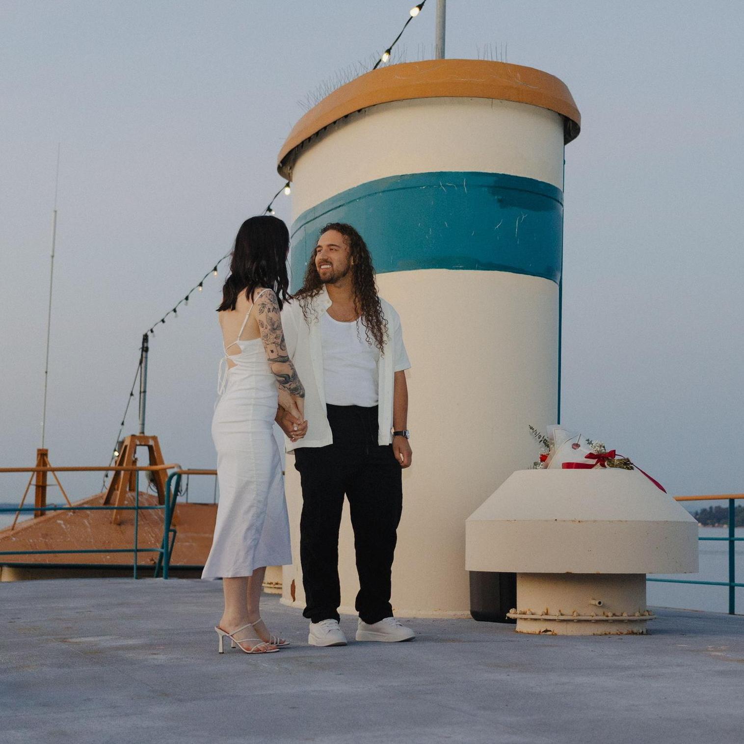 Joash leading Kate over to their proposal spot. On the rooftop of a boat. Such a dream.