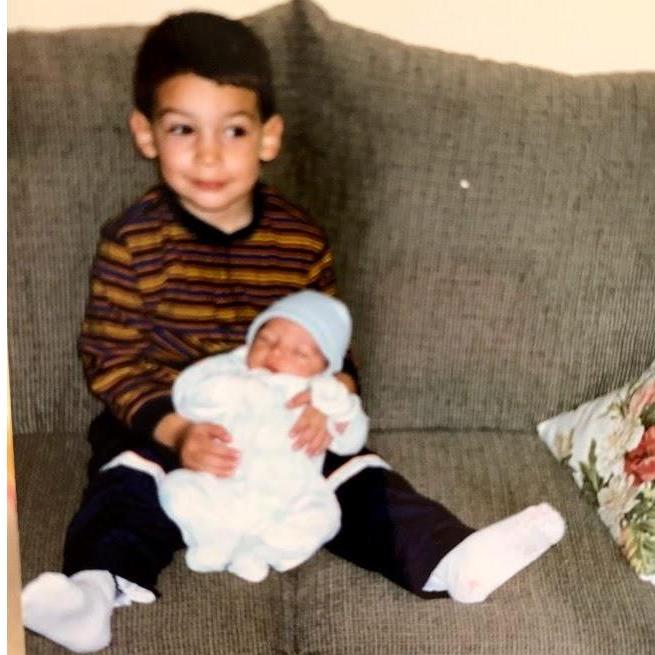 Chris welcoming his baby brother into the world :)