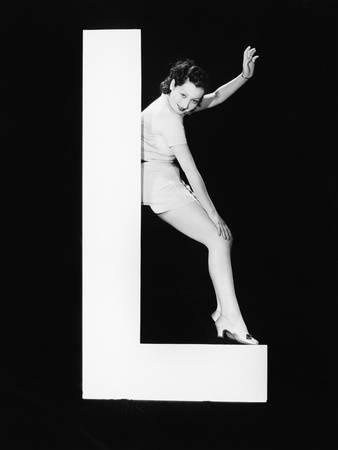 Woman with Huge Letter L Photographic Print by Everett Collection at Art.com