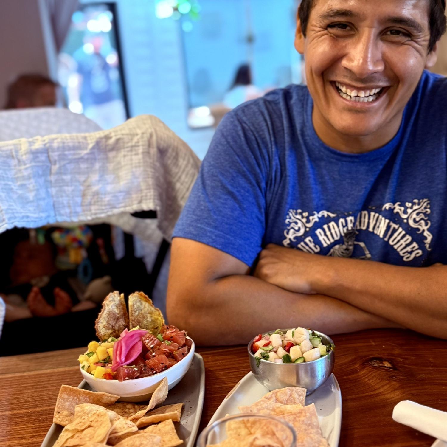 Ian smiling from ear to ear because we finally got our ceviche from Ceviche's in Wilmington. Baby Jeff in the background couldn't have cared less!
